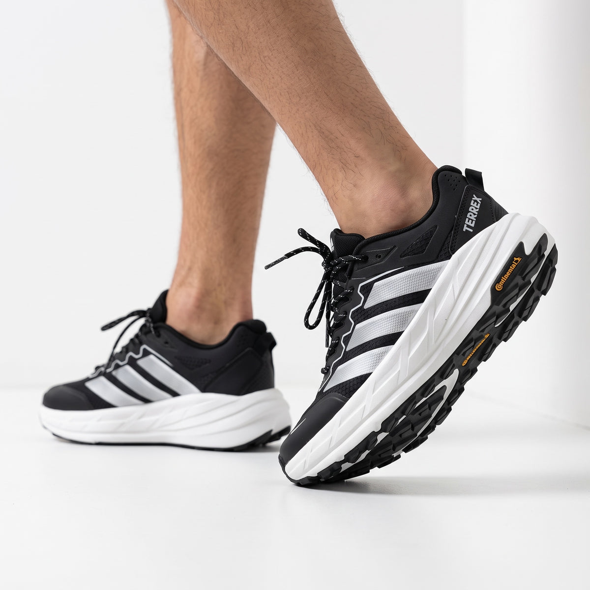 black adidas terrex trail running shoe with white midsole and continental outsole