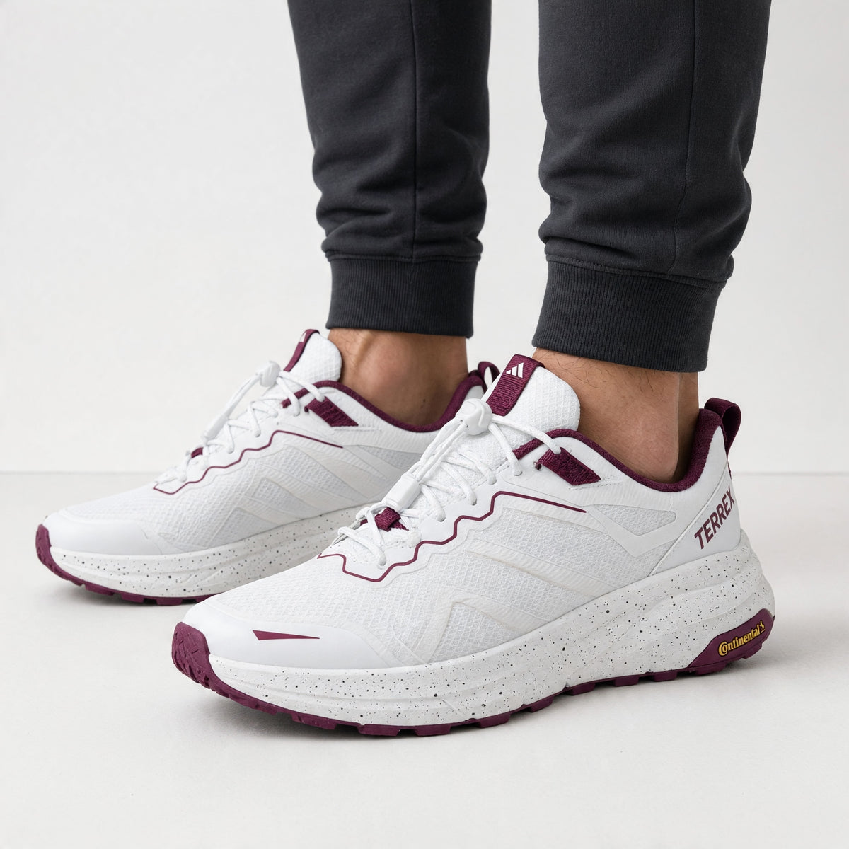 Adidas Terrex white sneaker with maroon accents and speckled midsole