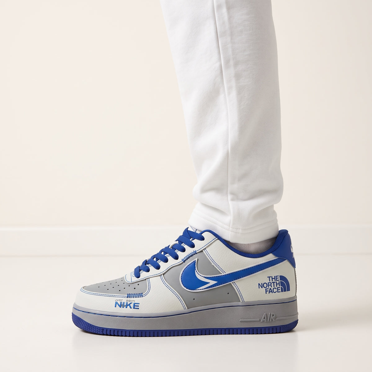 Nike Air Force 1 Low white grey blue sneaker with The North Face logo