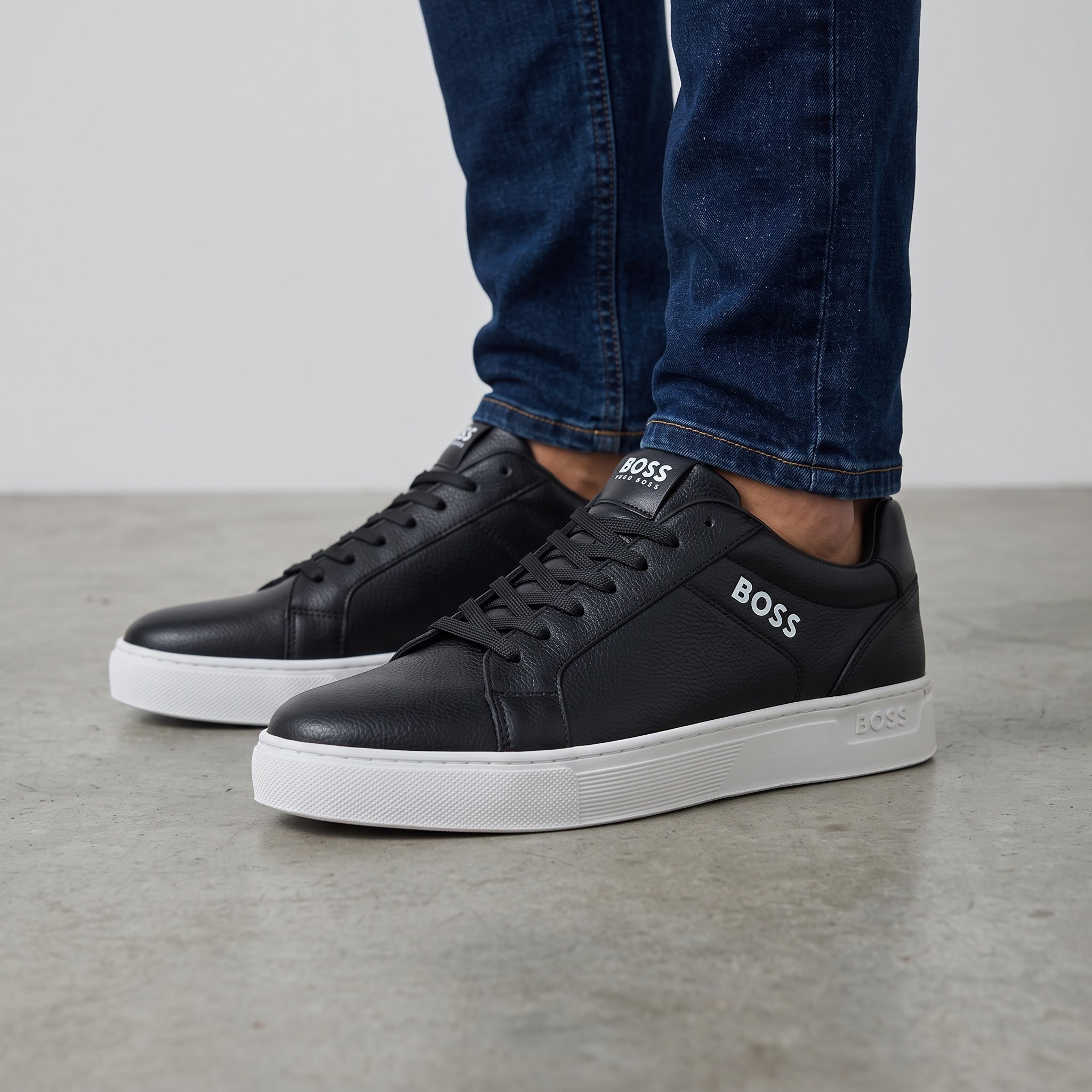 Hugo Boss black low-top sneakers with white platform sole and BOSS logo