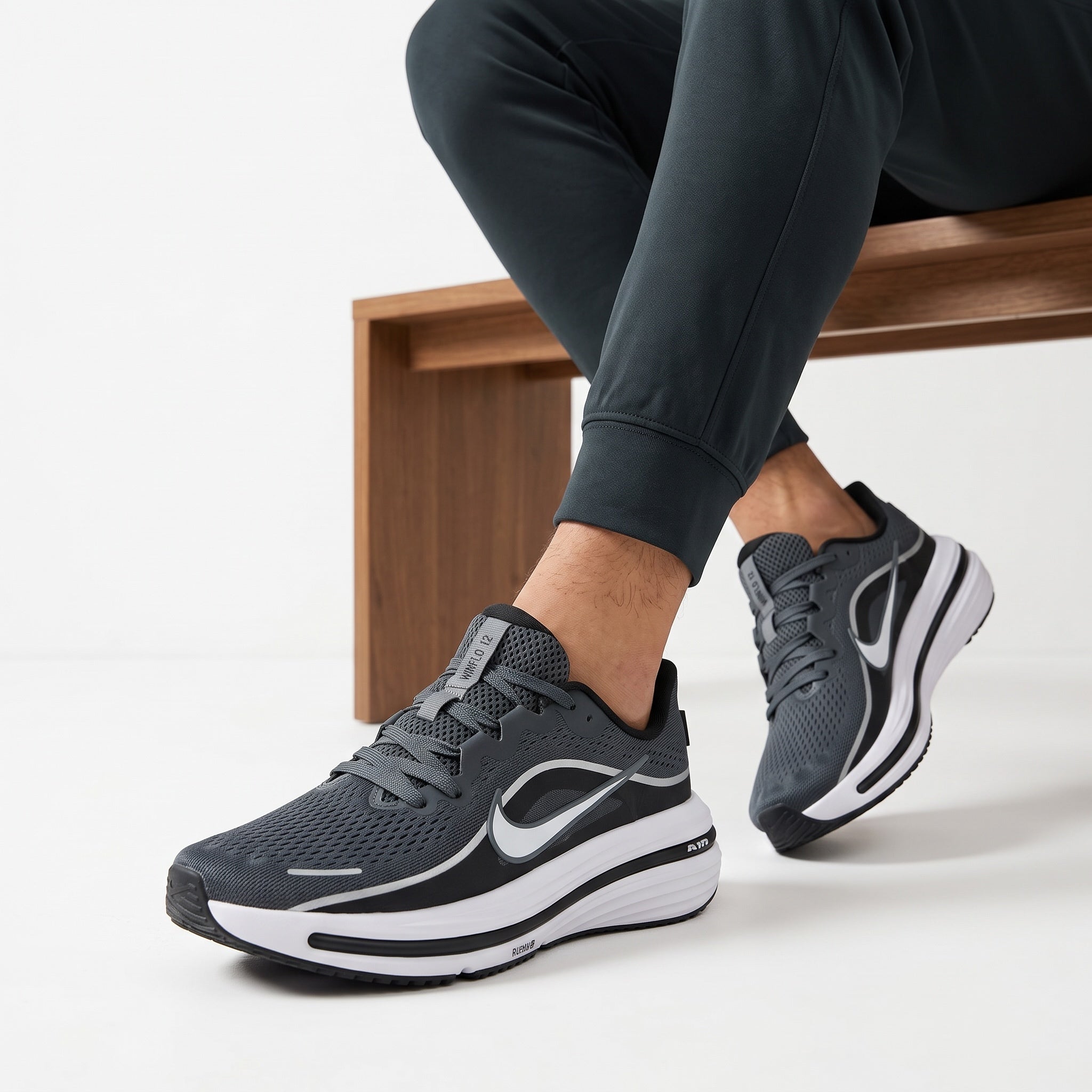 dark grey Nike running trainers with white sole and Swoosh