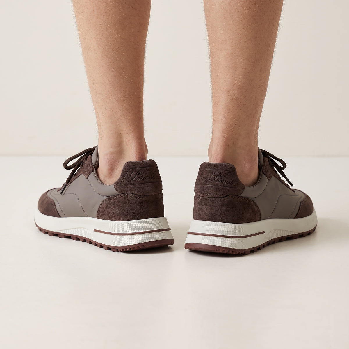 Loro Piana low-top brown trainers with layered upper and white platform sole