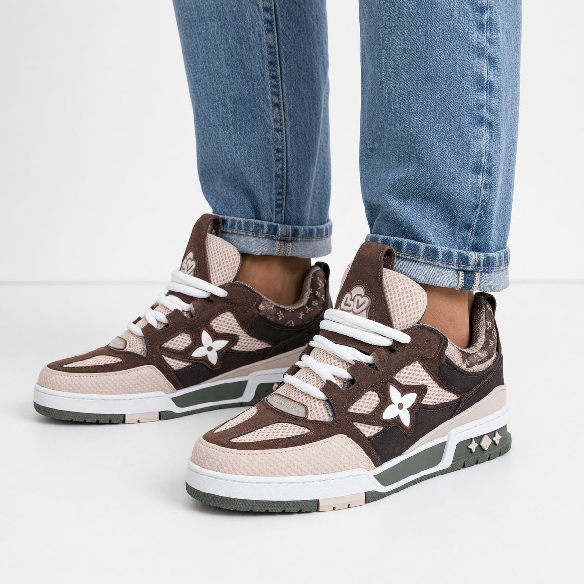 brown and beige Louis Vuitton chunky trainer with LV floral motif and green sole
