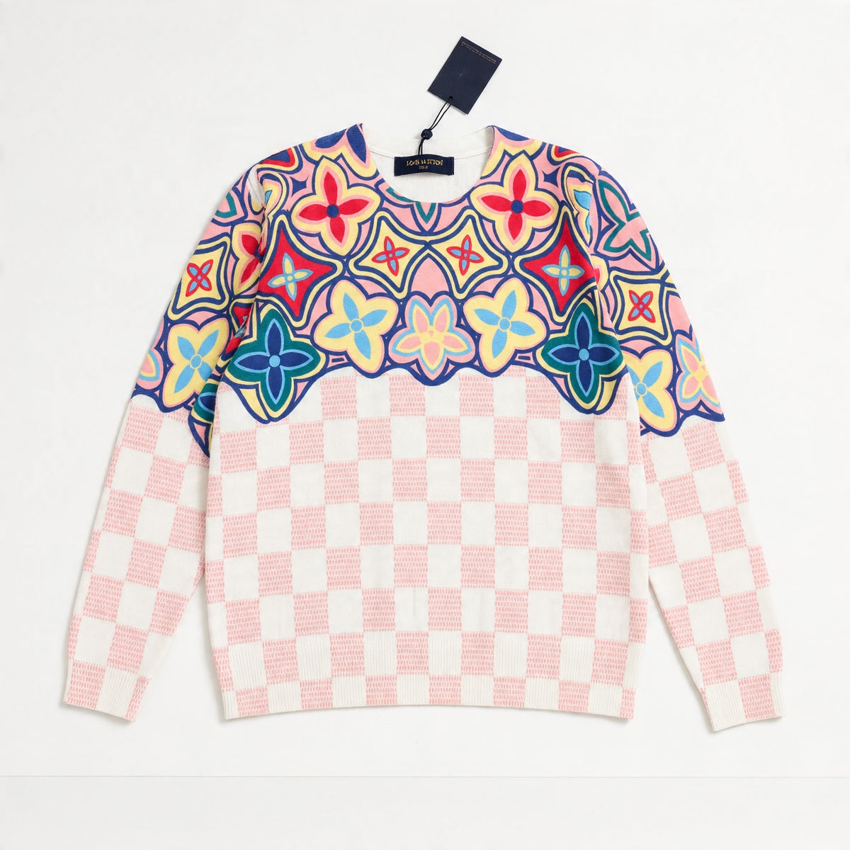 pink checkerboard sweater with multicolor floral yoke and crewneck