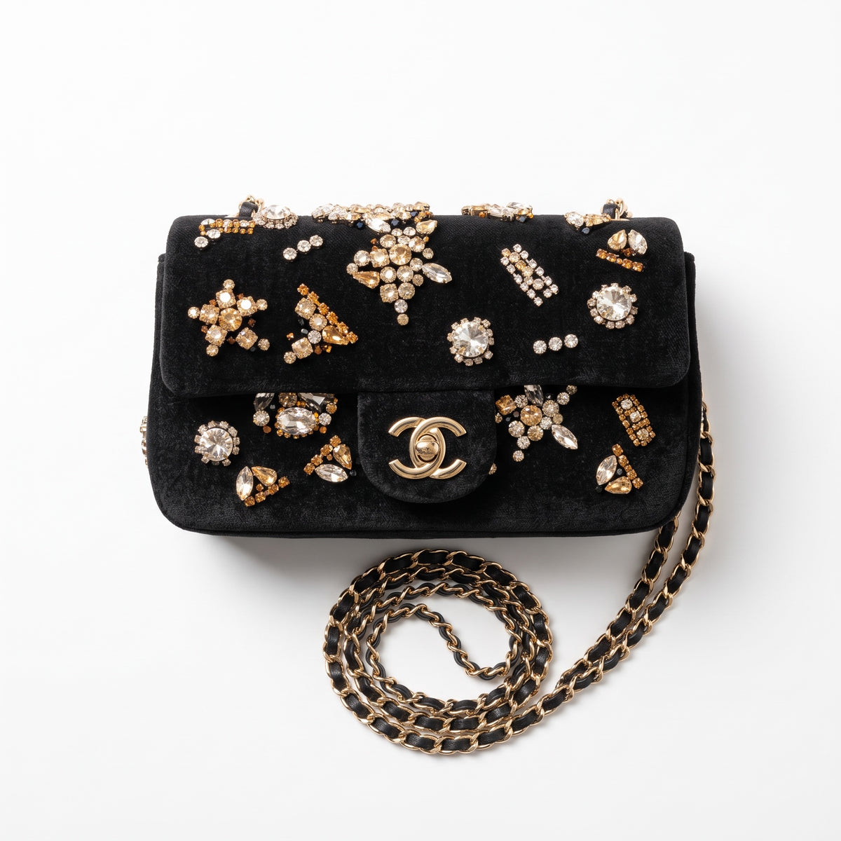 Chanel black velvet flap bag with jeweled embellishments and gold chain strap