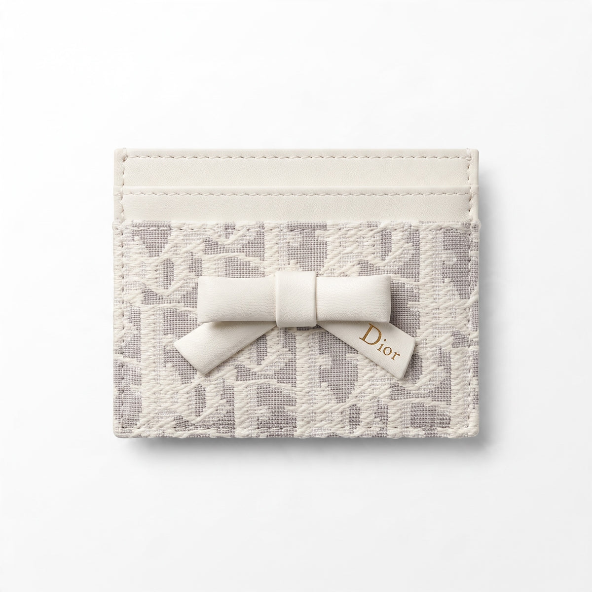 White Dior card holder with bow and textured oblique pattern
