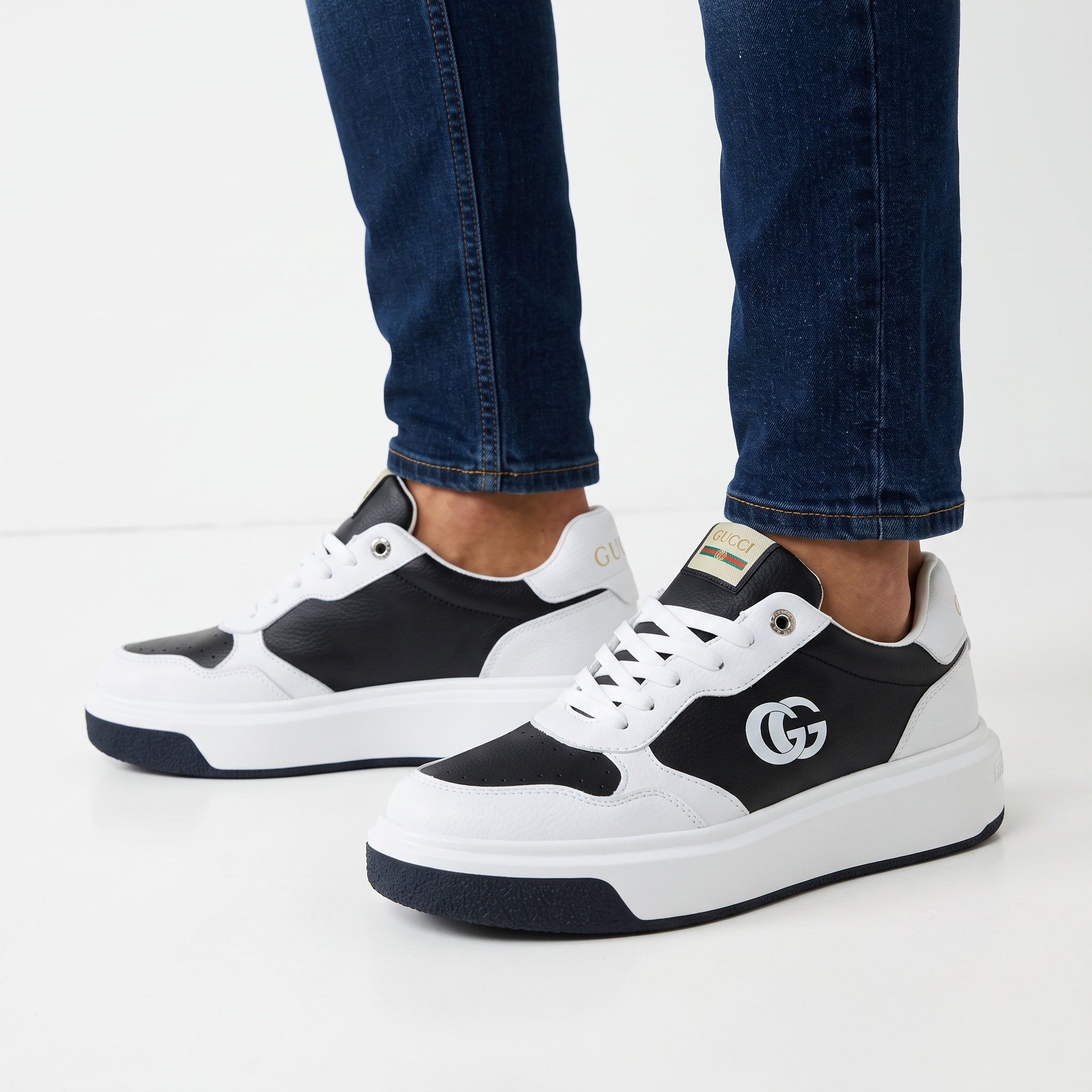 Black and white Gucci chunky low-top sneakers with GG logo and chunky sole
