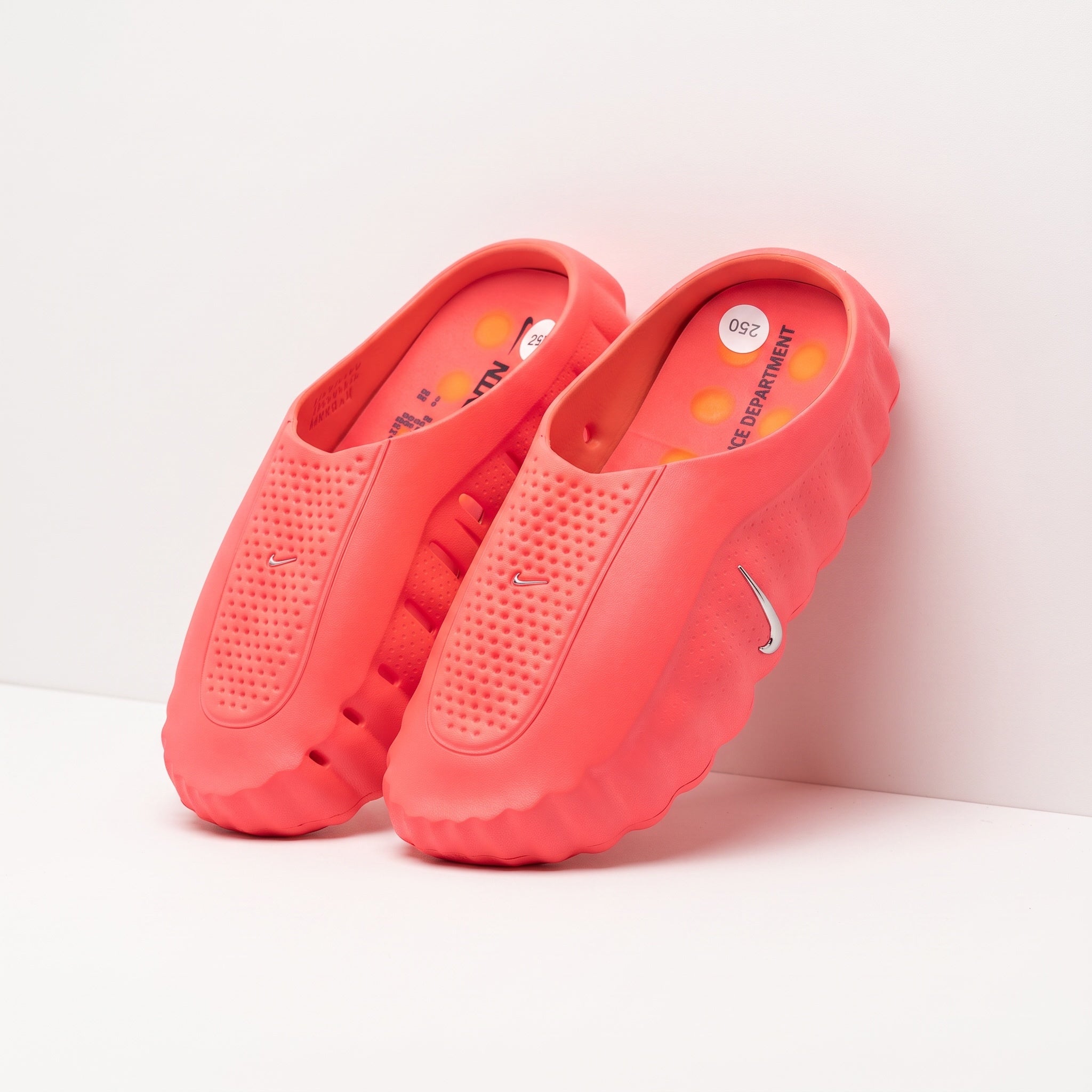 Nike coral foam molded clogs with perforated upper and sculpted sole