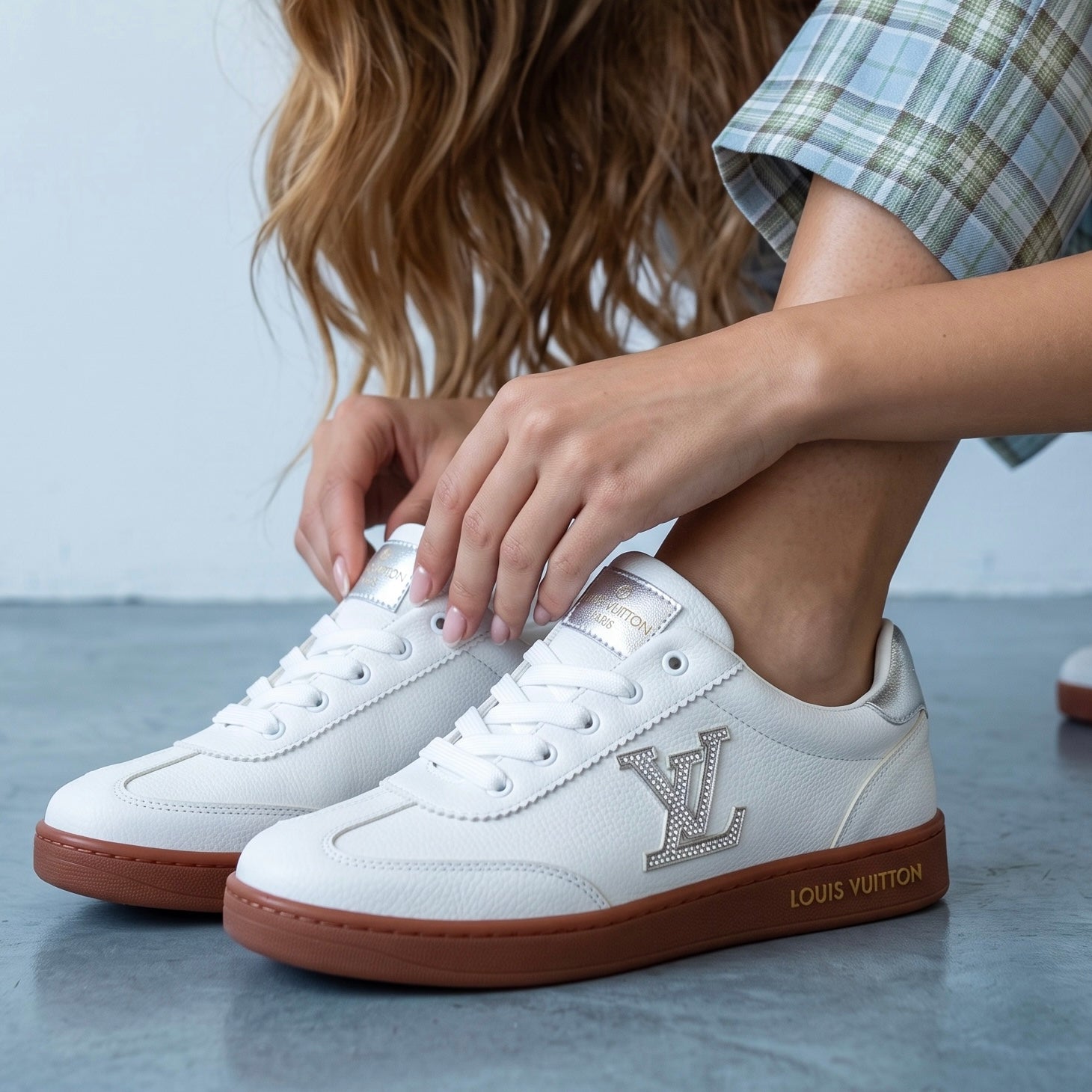 White Louis Vuitton low-top sneaker with gum sole and LV logo
