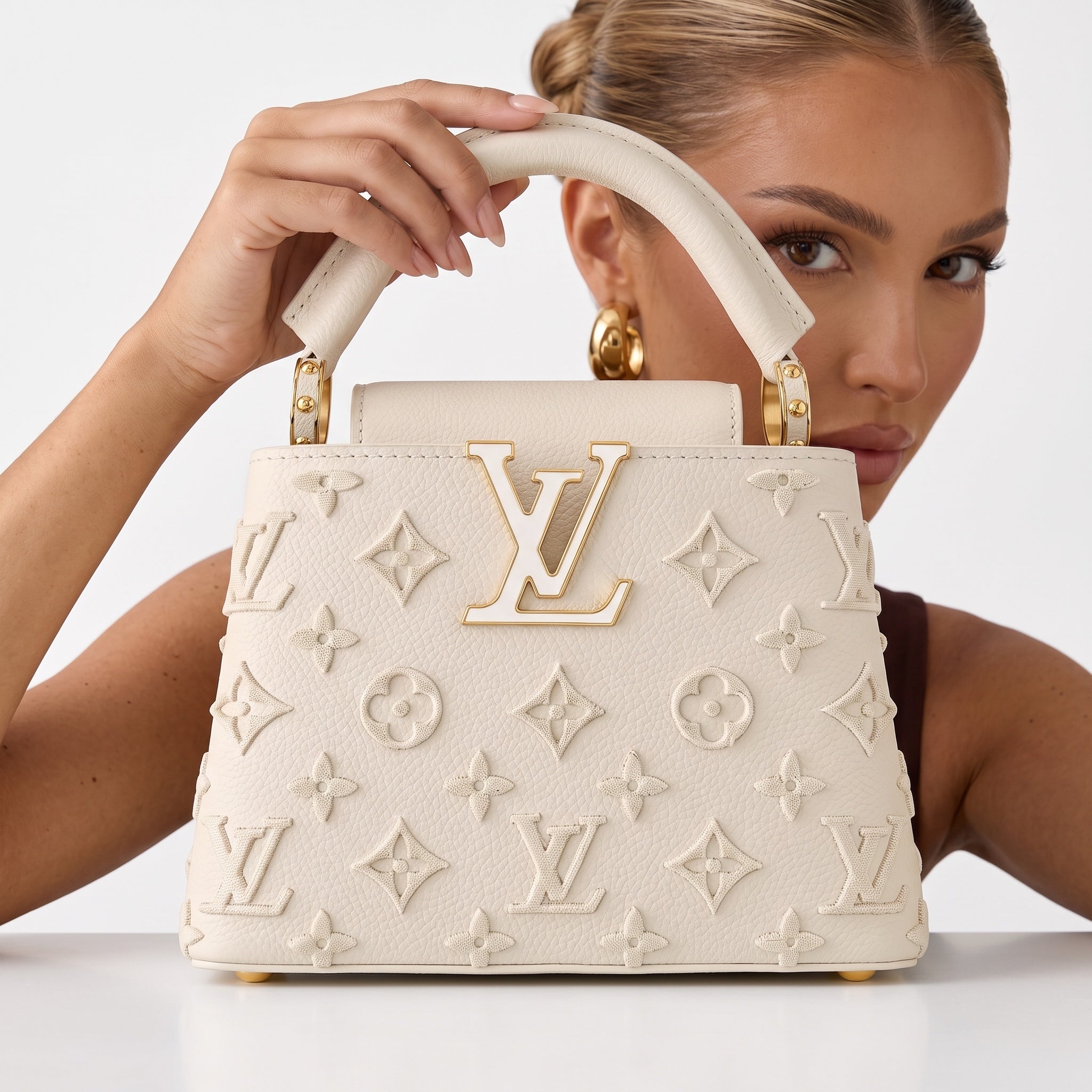 Cream Louis Vuitton top-handle bag with LV logo and monogram appliqué