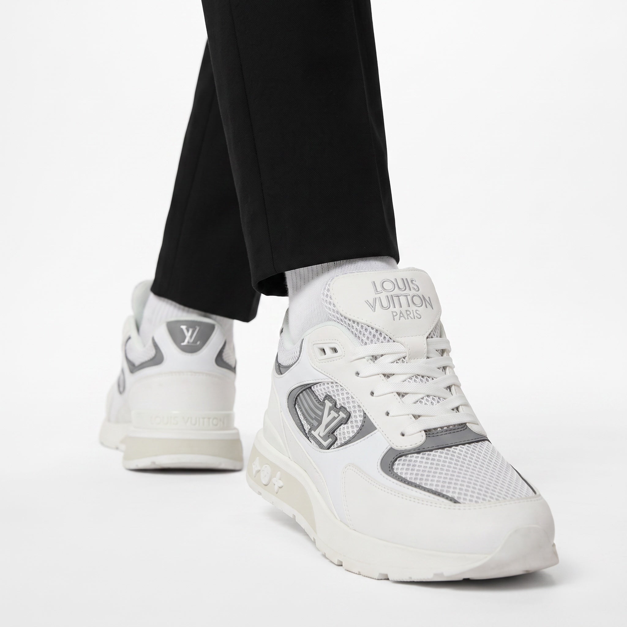White and grey Louis Vuitton men's sneaker with LV badge and chunky sole