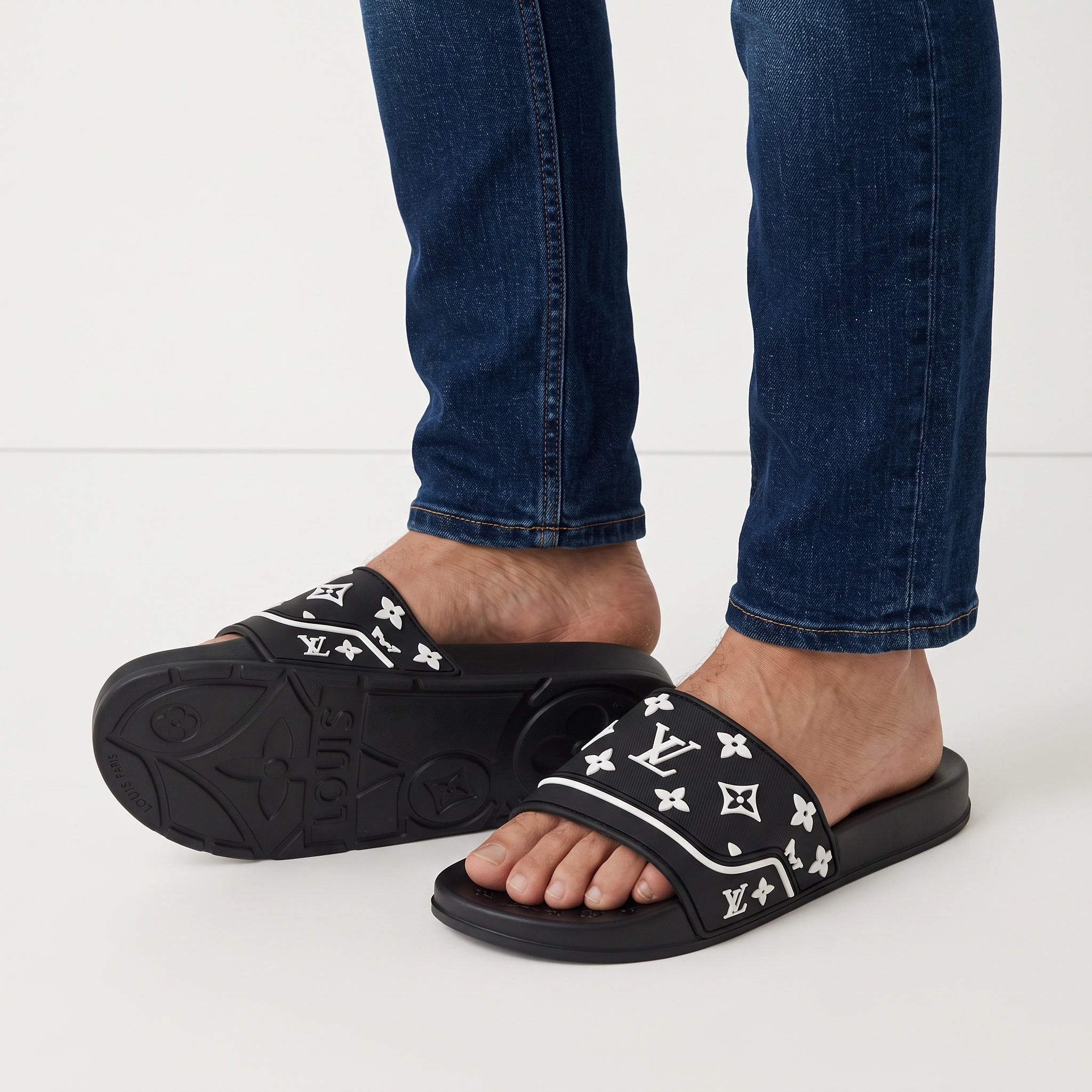 black Louis Vuitton monogram slide sandals with white logos