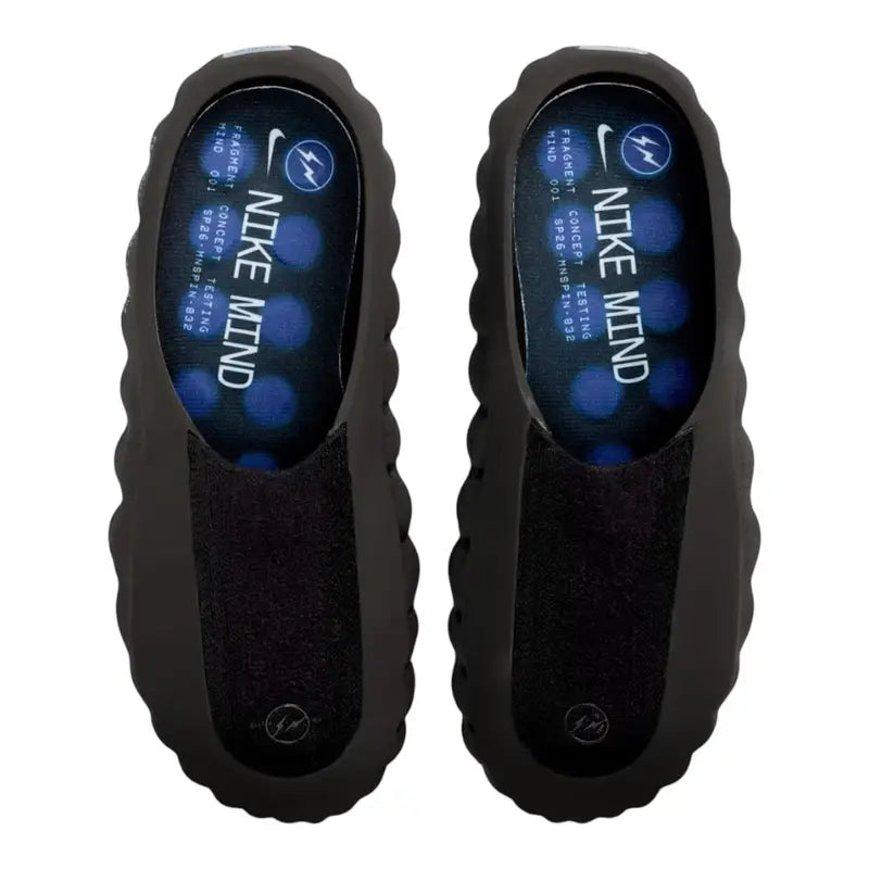 Black Nike Mind slip-on clog with blue circular pods on the sole