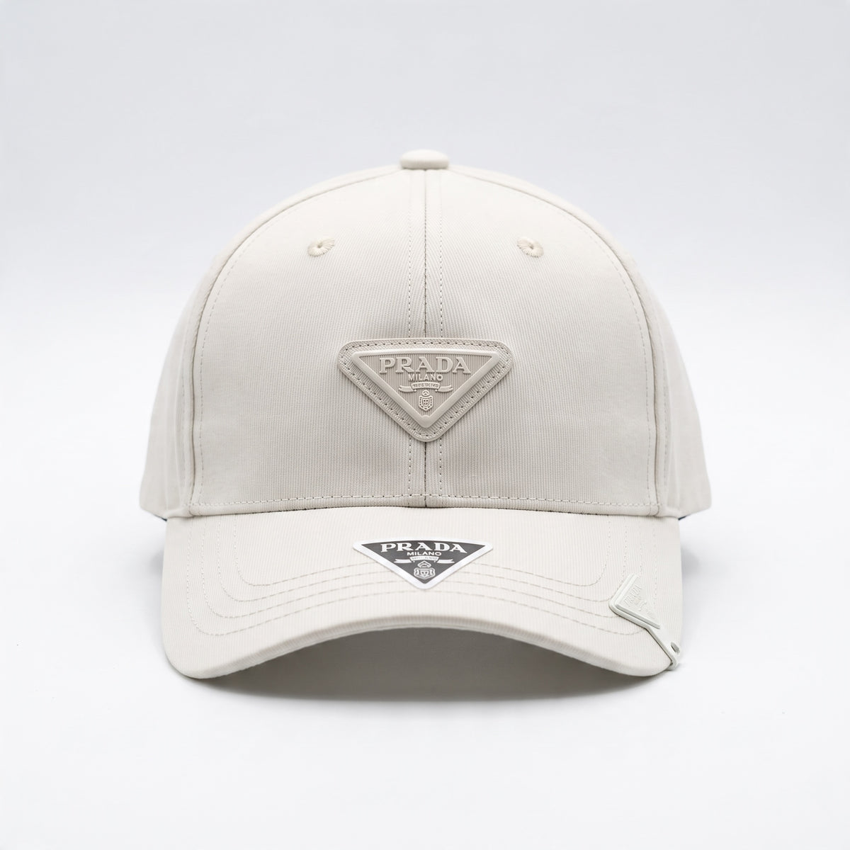 Ivory Prada baseball cap with tonal triangle logo plaque on front
