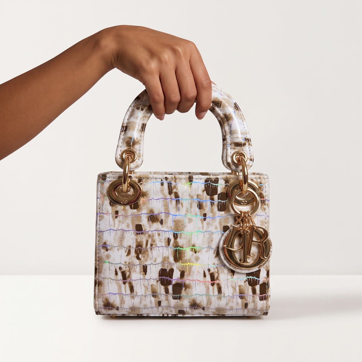 mini Dior Lady Dior top-handle bag with brown holographic patterned finish and gold charms