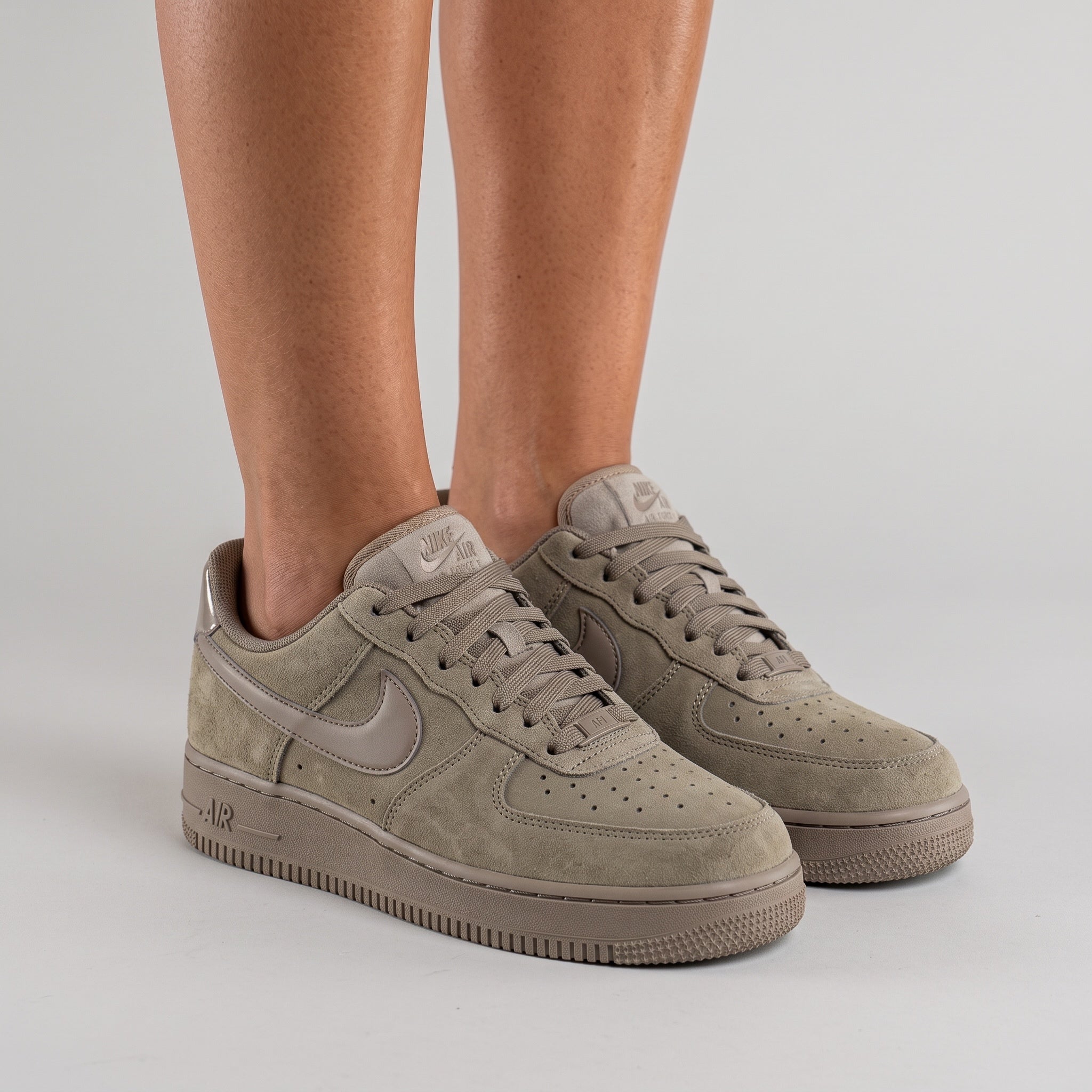 Taupe Nike Air Force 1 low-top sneaker with suede-look panels