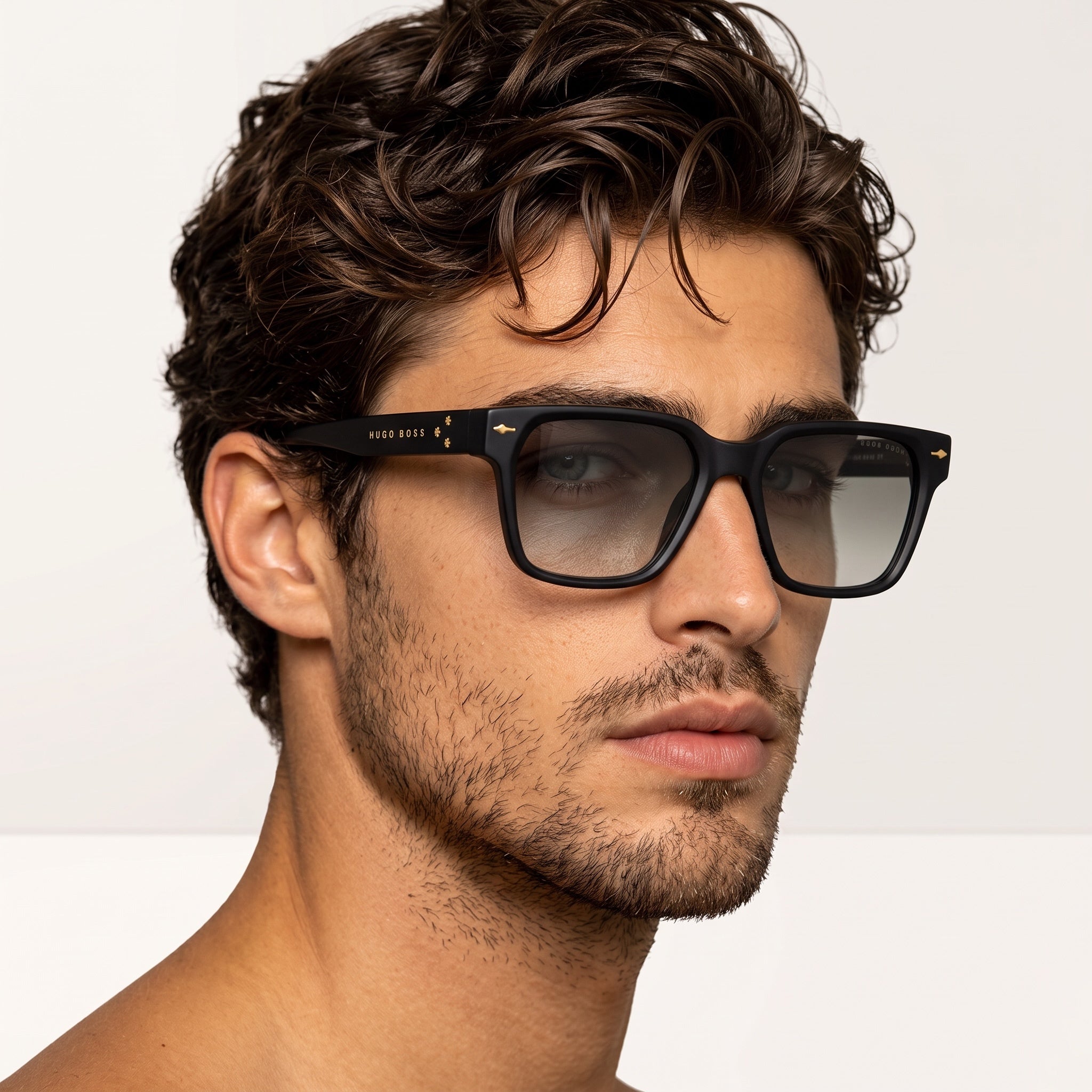 Close-up of Hugo Boss black square sunglasses on male model