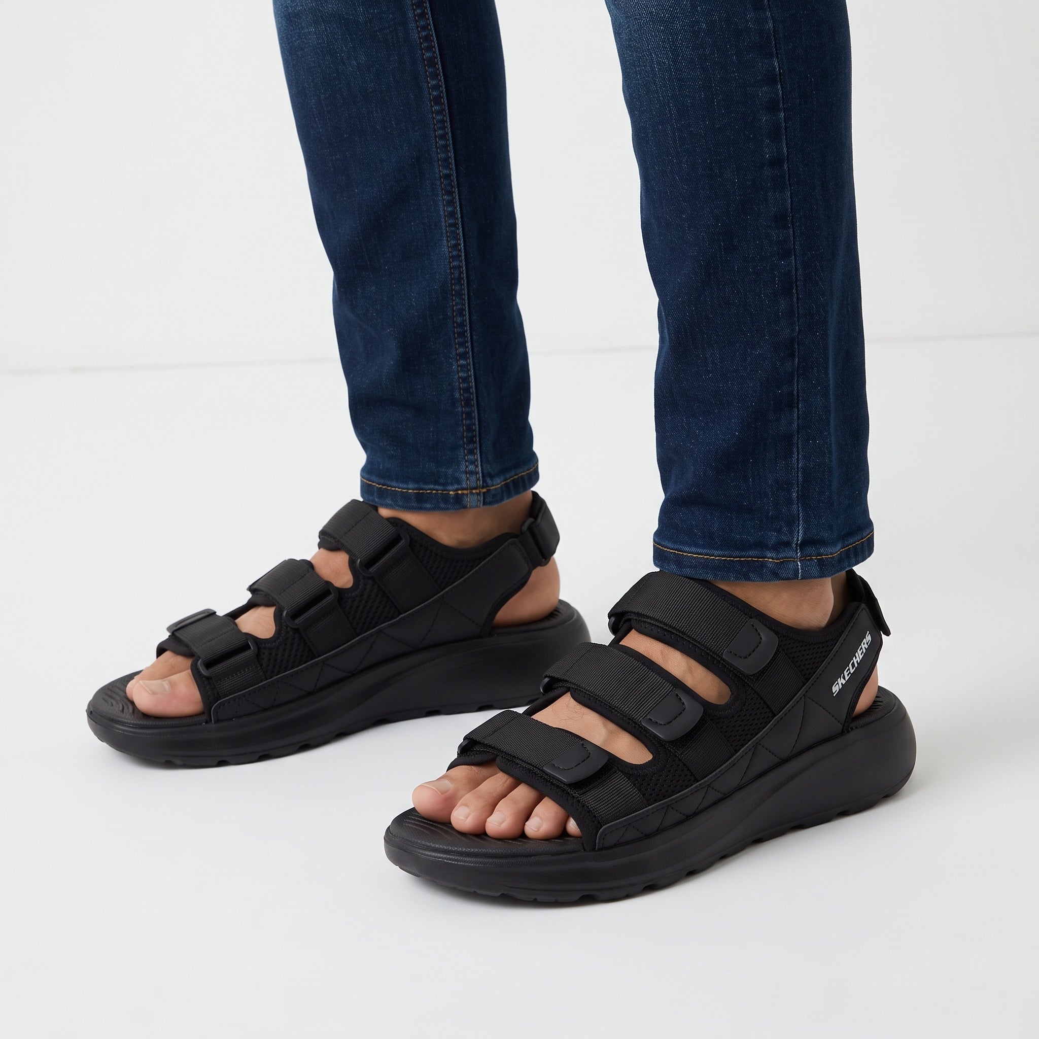 Black Skechers chunky platform sandals with three adjustable straps