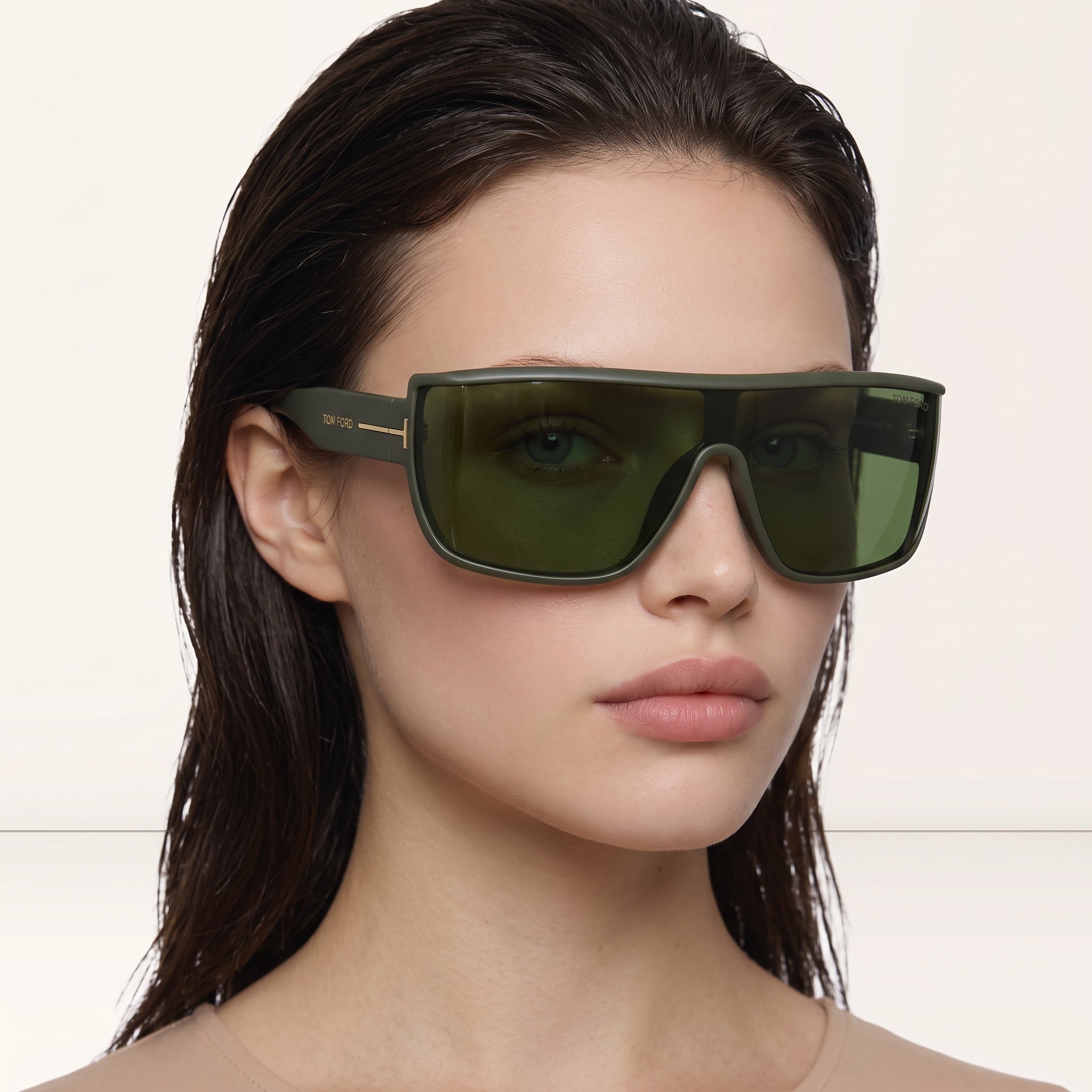 Tom Ford oversized olive green shield sunglasses with gold T logo on temple