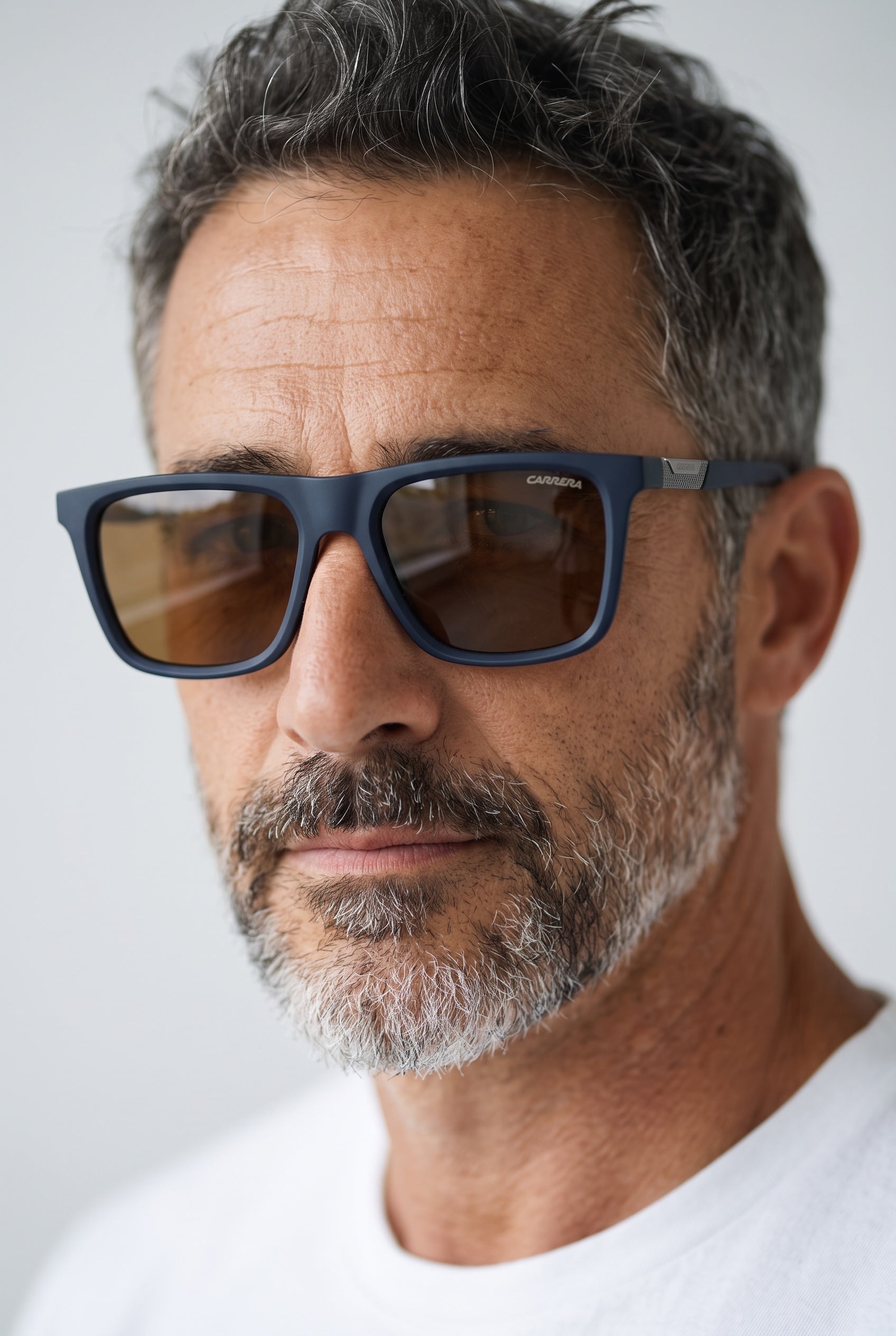 Carrera matte navy square sunglasses with brown lenses on male model