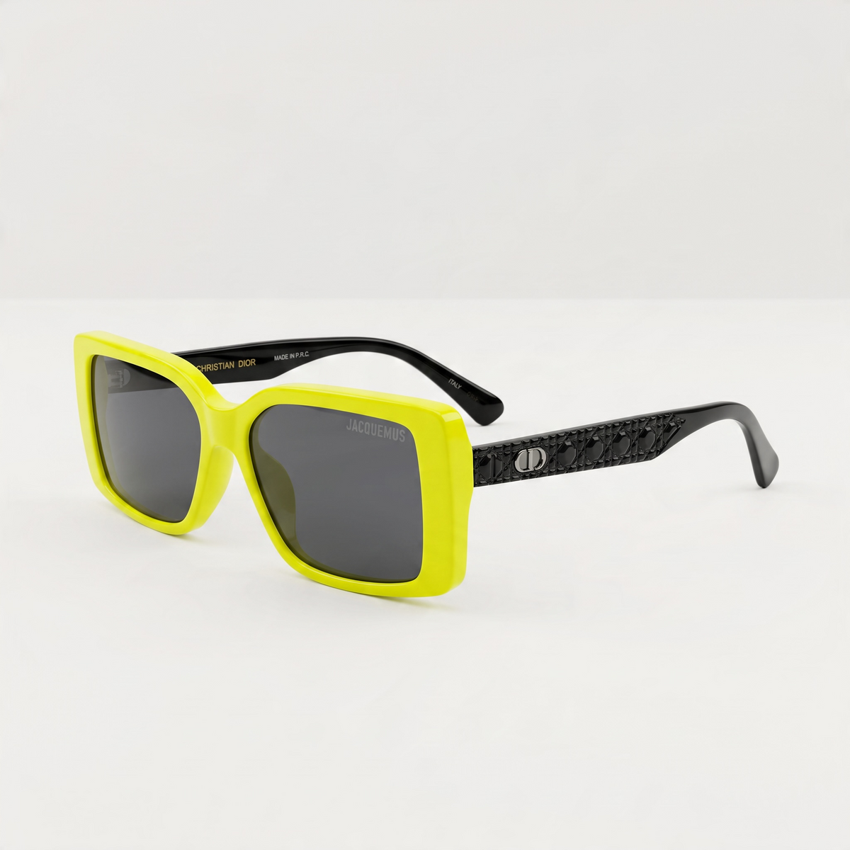 Neon yellow square Jacquemus sunglasses with dark lenses and black arms