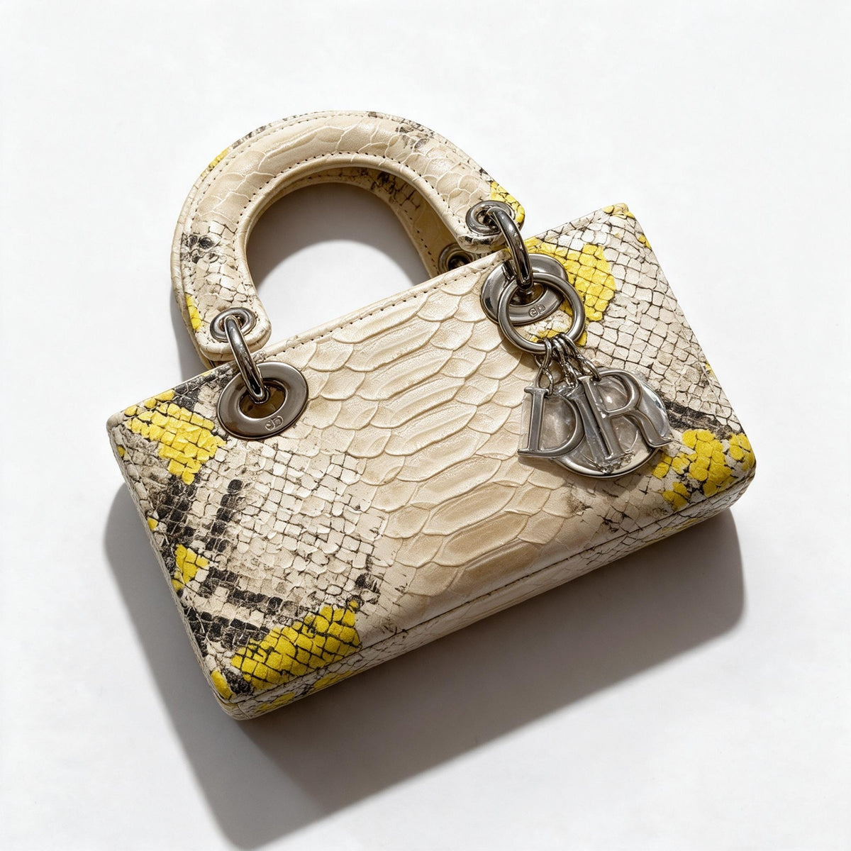 Cream and yellow python mini Lady Dior top-handle bag with silver charms