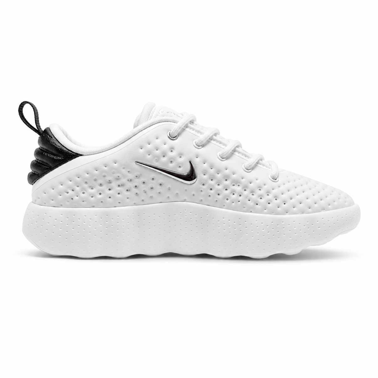 White Nike low-top perforated sneaker with black heel and podded sole
