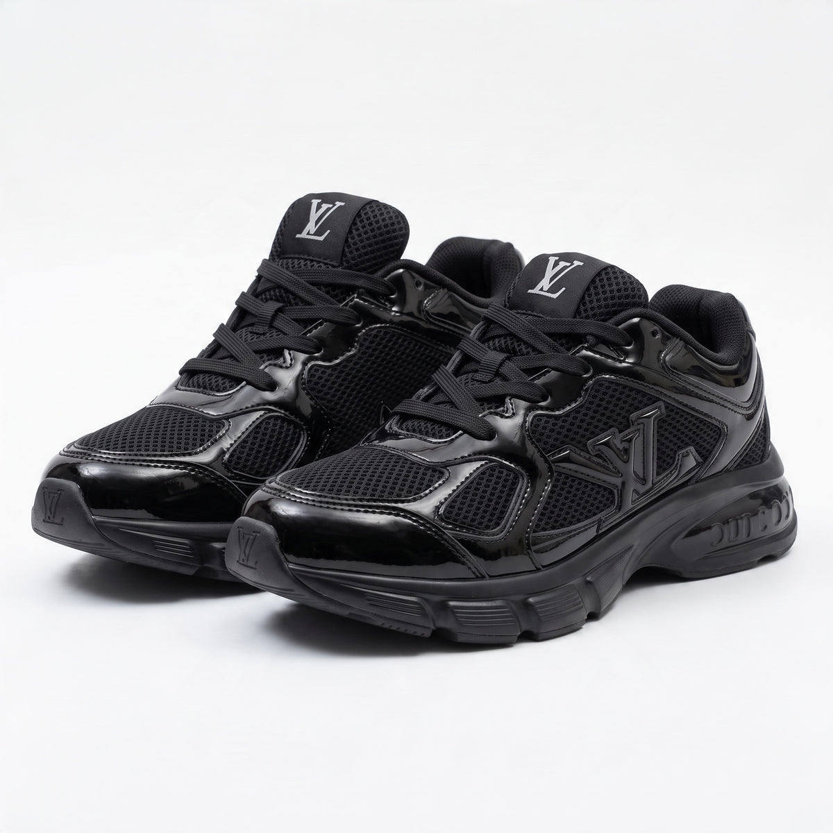 pair of all-black Louis Vuitton chunky sneakers with LV logo on tongue and sole