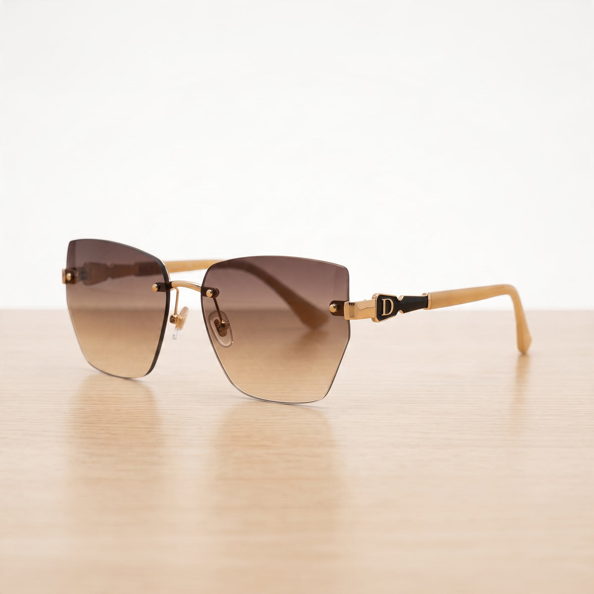 Dior rimless sunglasses with brown gradient lenses and gold-tone temples