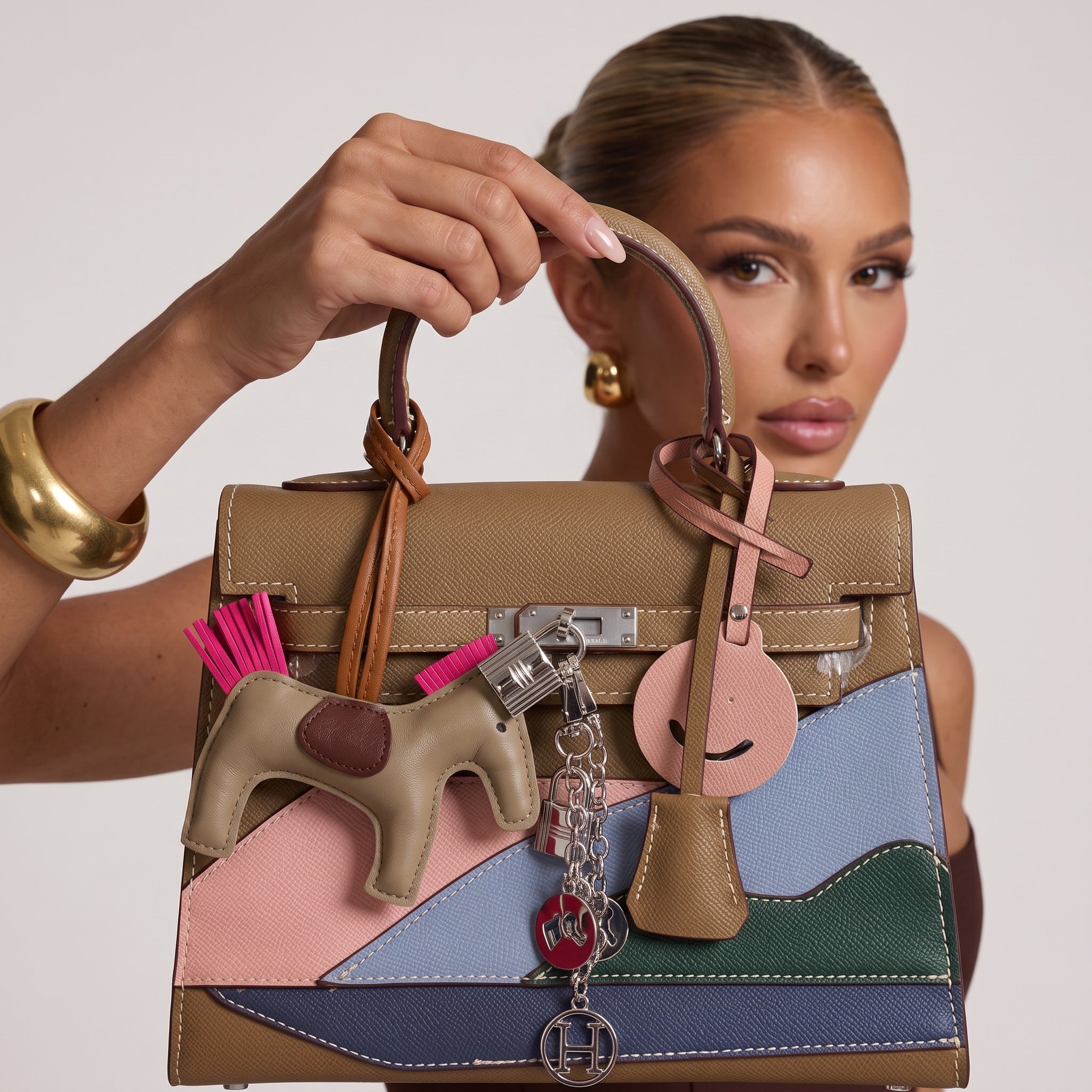 Hermรจs Kelly top-handle bag in multicolor patchwork with charms and silver hardware
