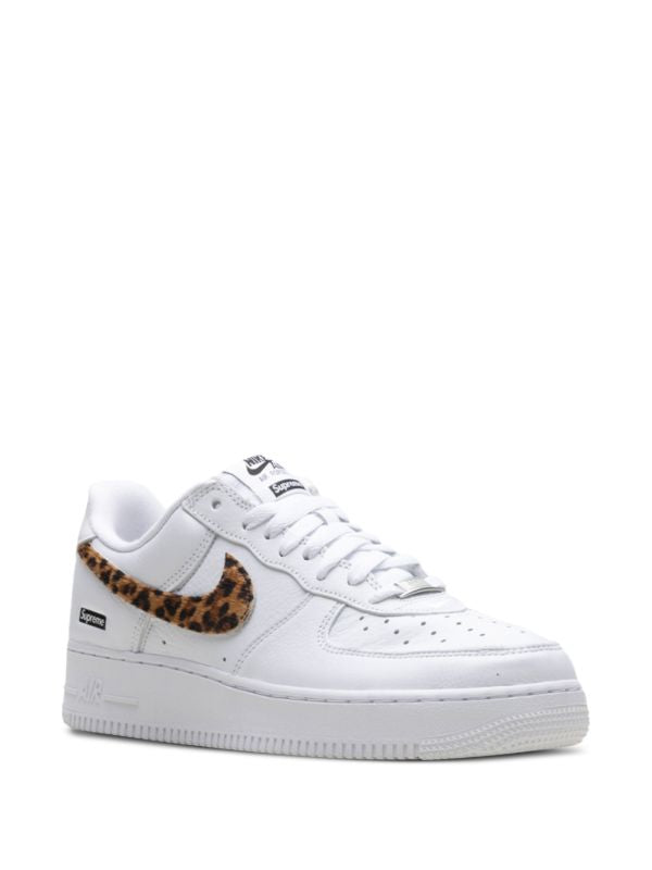 White Nike Air Force 1 Low sneaker with leopard-pattern Swoosh and Supreme box logo