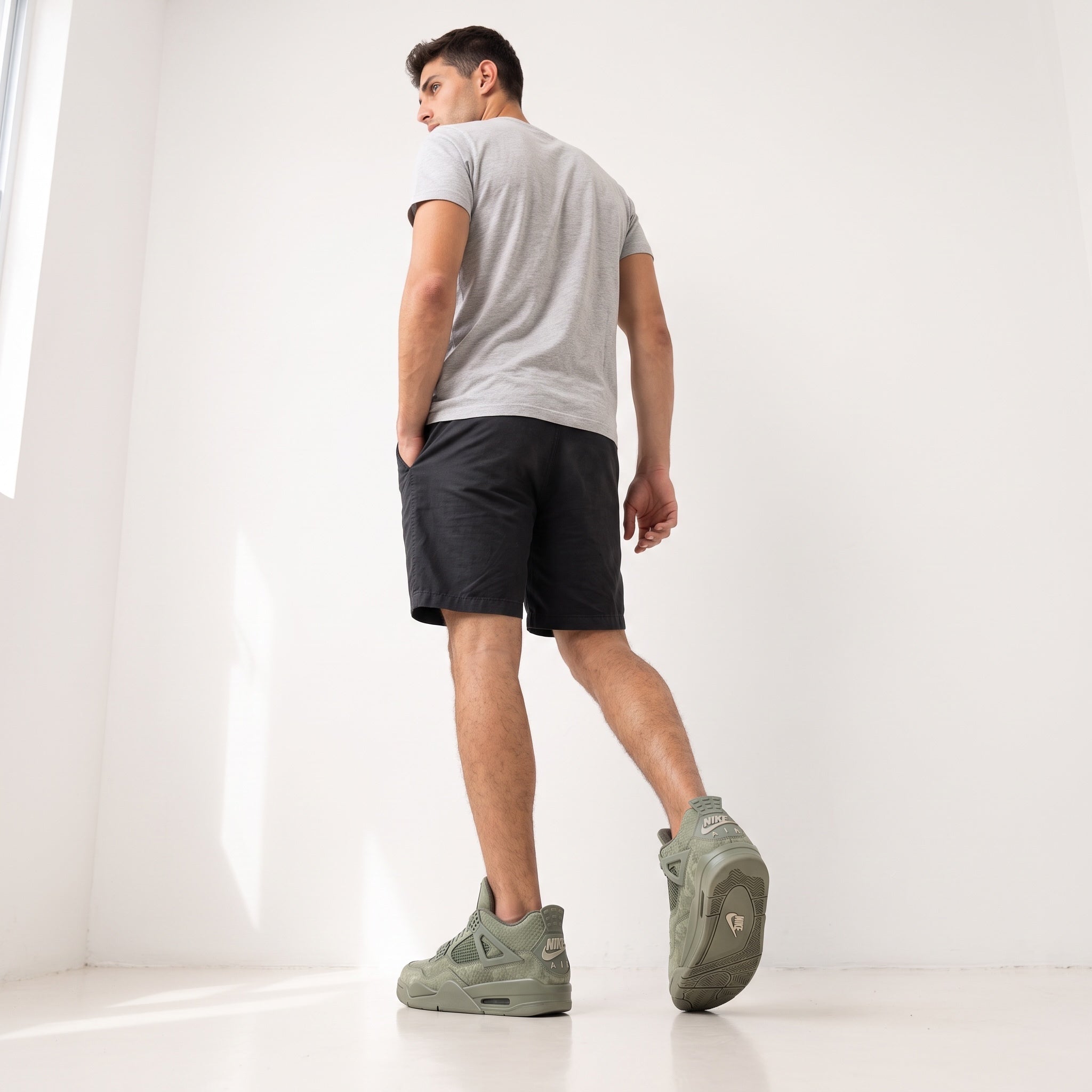 Olive green Air Jordan 4 sneakers with Jumpman tongue and NIKE AIR heel branding