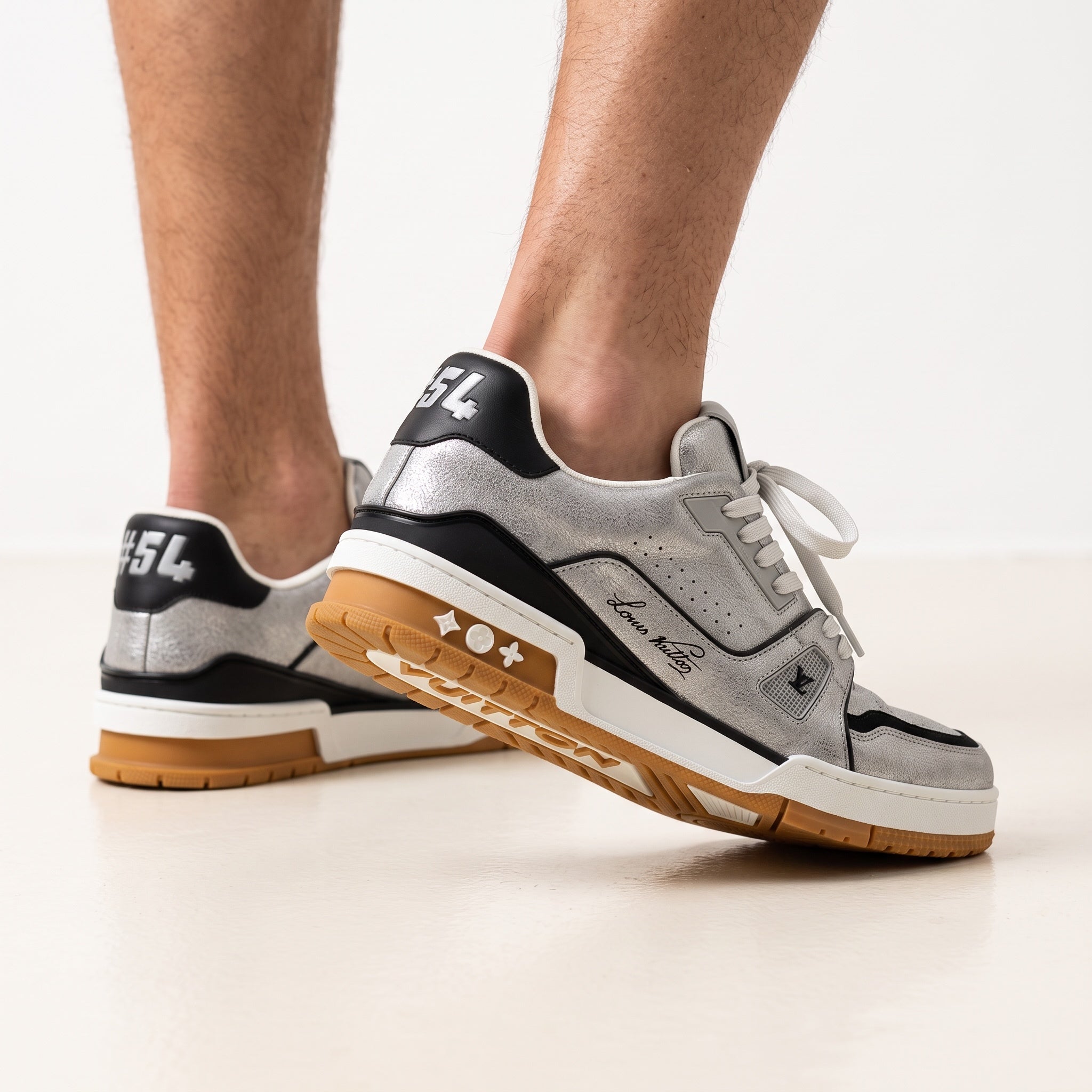 Louis Vuitton silver metallic cracked low-top sneaker with gum sole and black heel tab