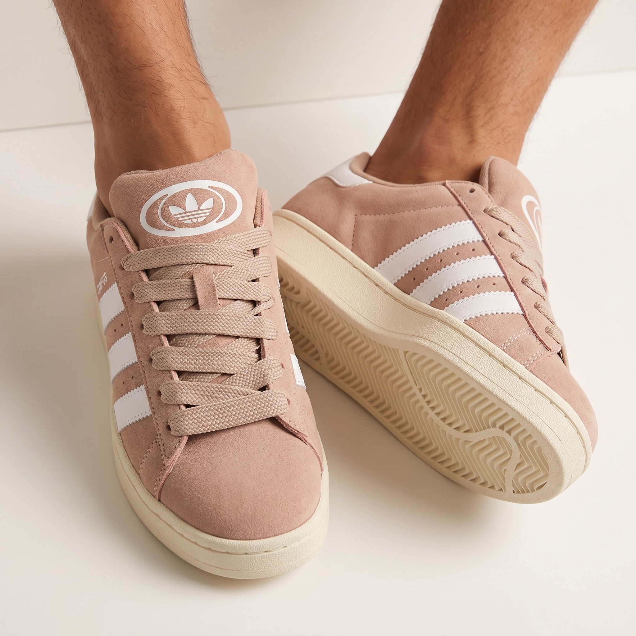 Adidas Campus blush pink low-top sneakers with white stripes