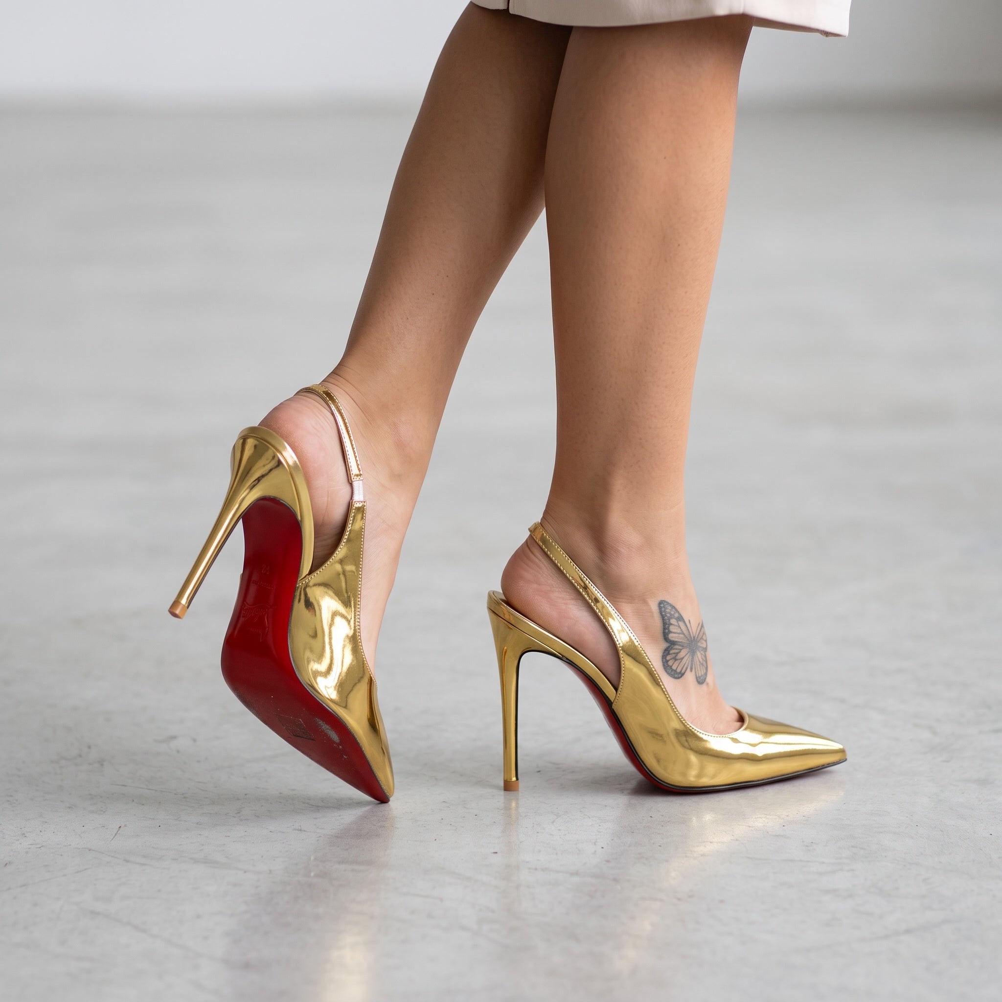 gold Christian Louboutin slingback high heels with red sole