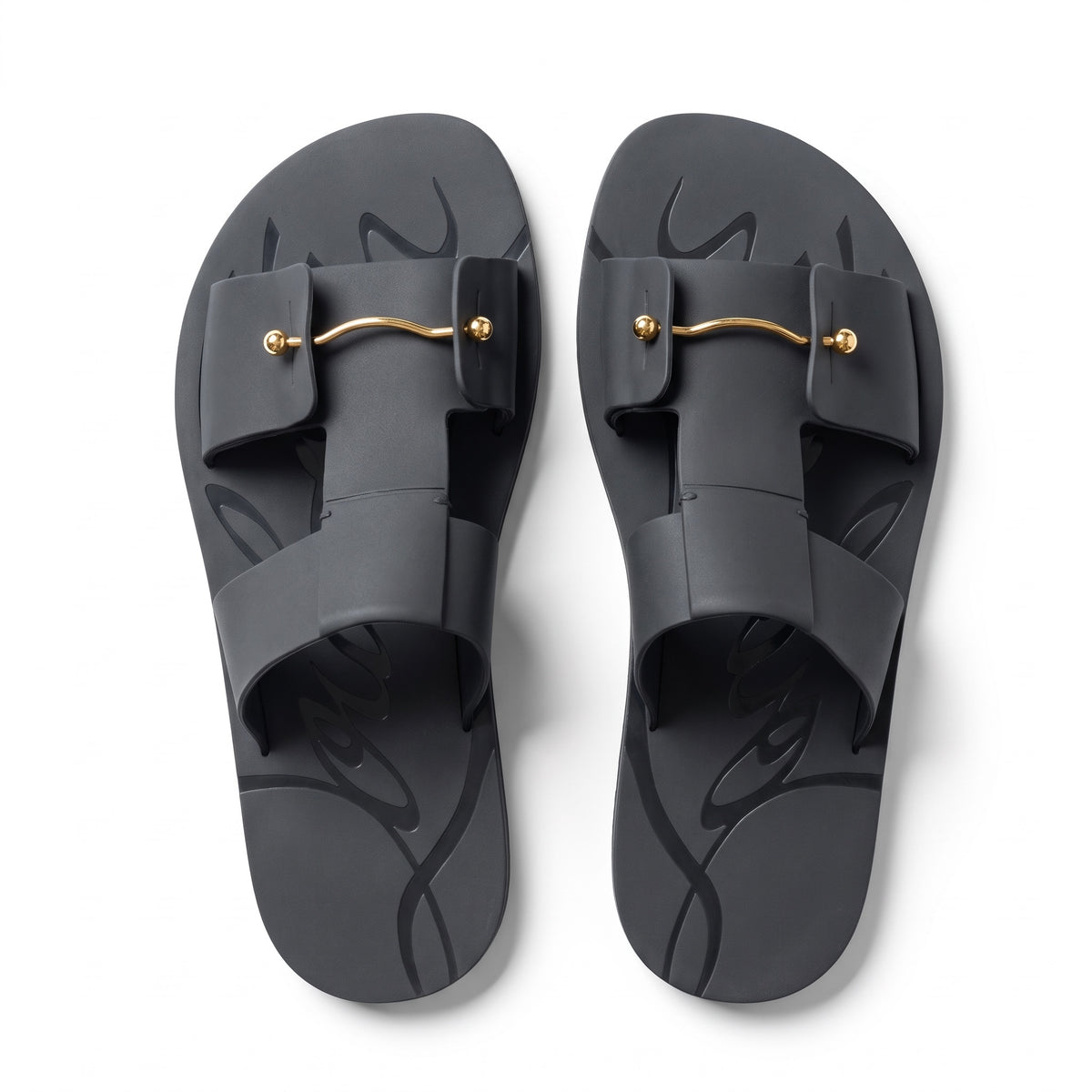 black Christian Louboutin rubber slide with red sole and gold-tone bar