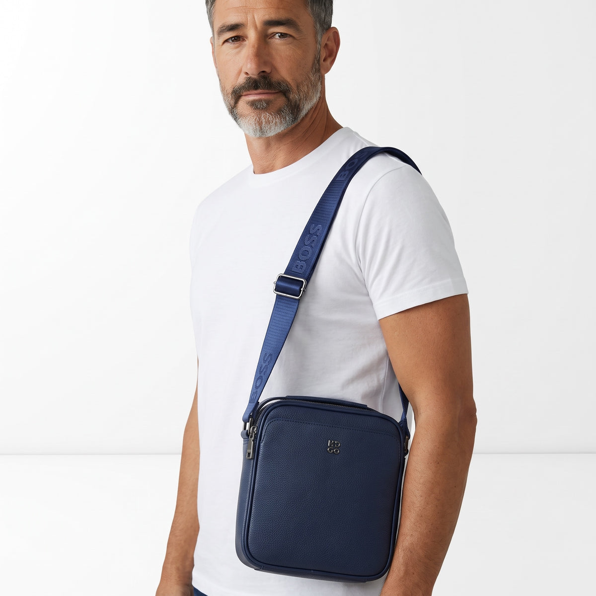 navy pebbled Boss crossbody mini bag with branded strap