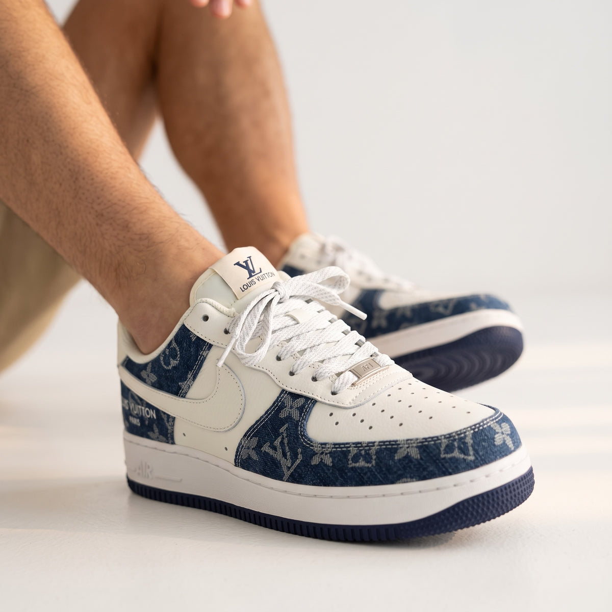 Louis Vuitton low-top trainers with blue monogram denim panels and white overlays