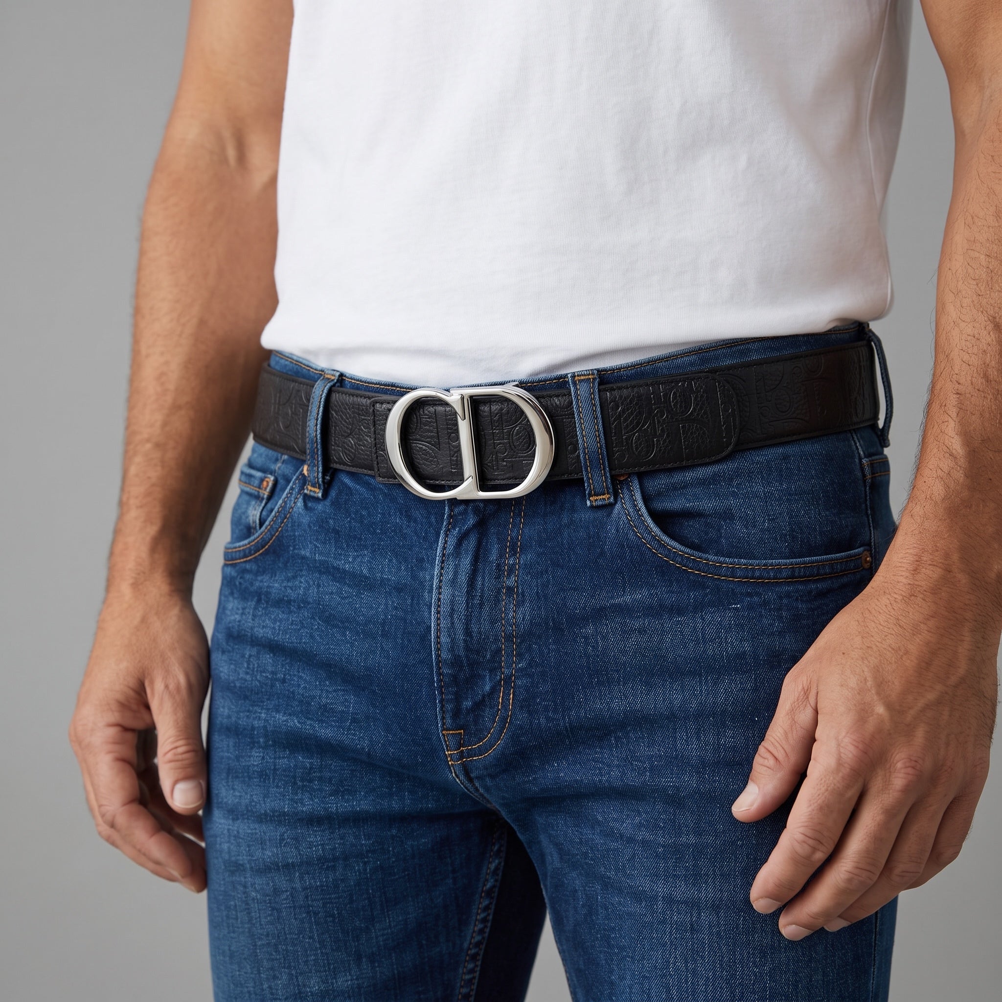 Black Dior belt with silver CD buckle worn with jeans