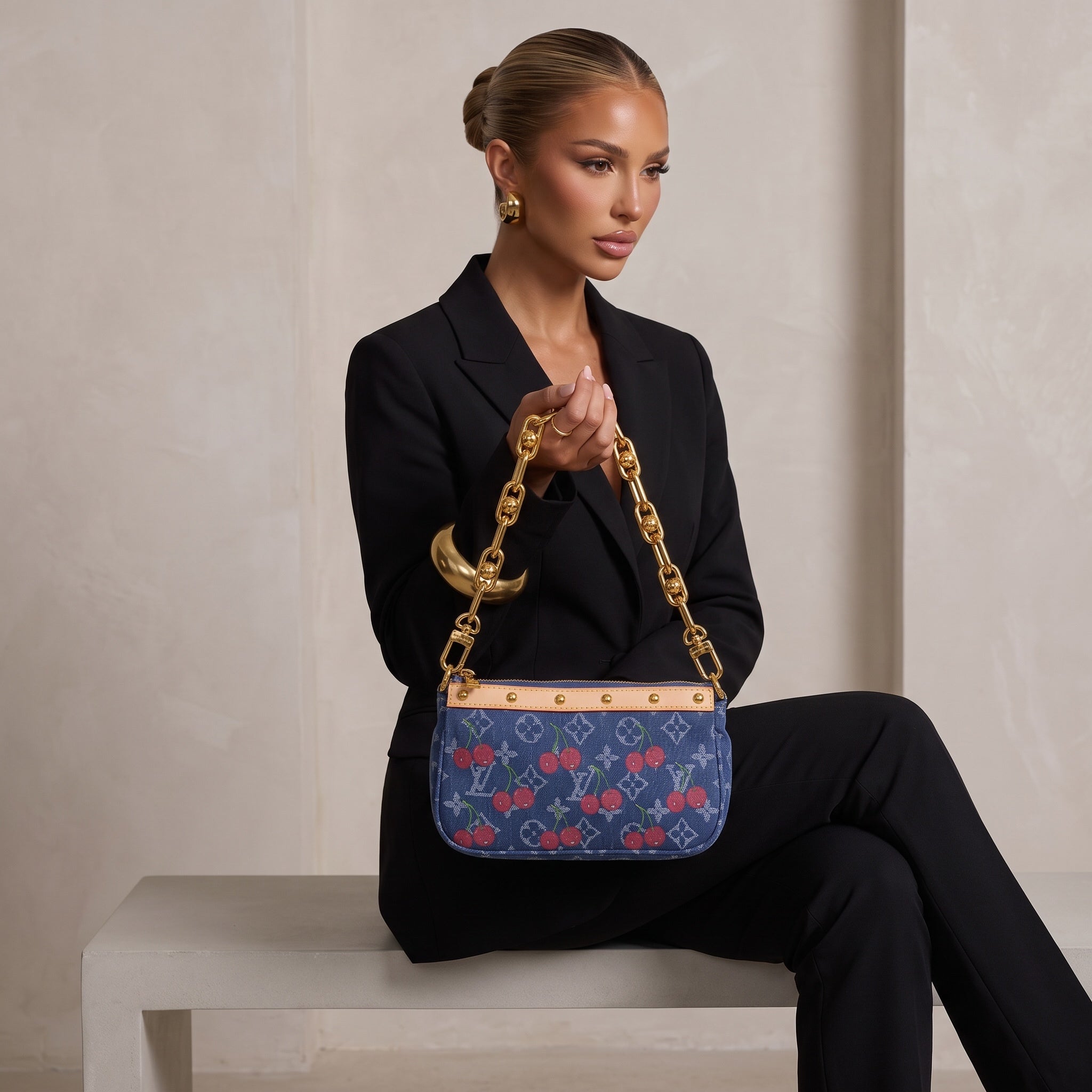 Blue denim Louis Vuitton shoulder bag with cherry print, tan trim and gold chain strap