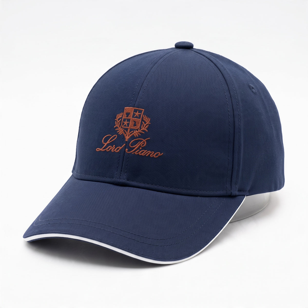 navy baseball cap with embroidered crest and white trim on brim