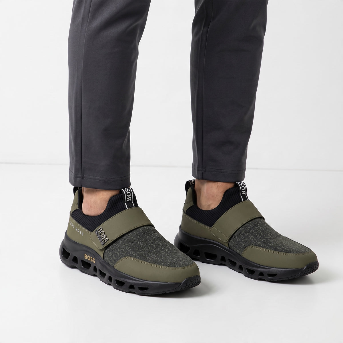 Hugo Boss olive green slip-on sneakers with tonal logo print and chunky ventilated sole