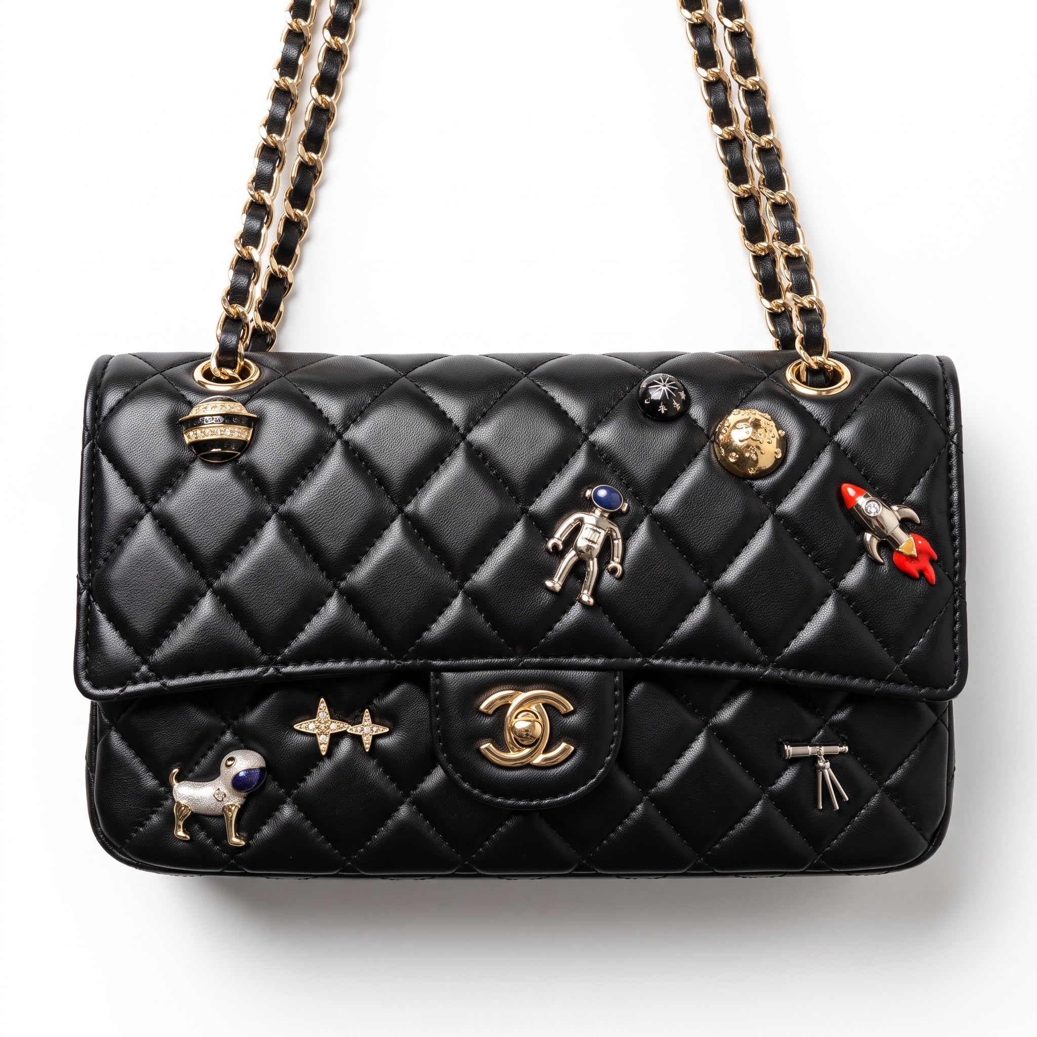Black quilted Chanel flap bag with gold chain strap and decorative pins