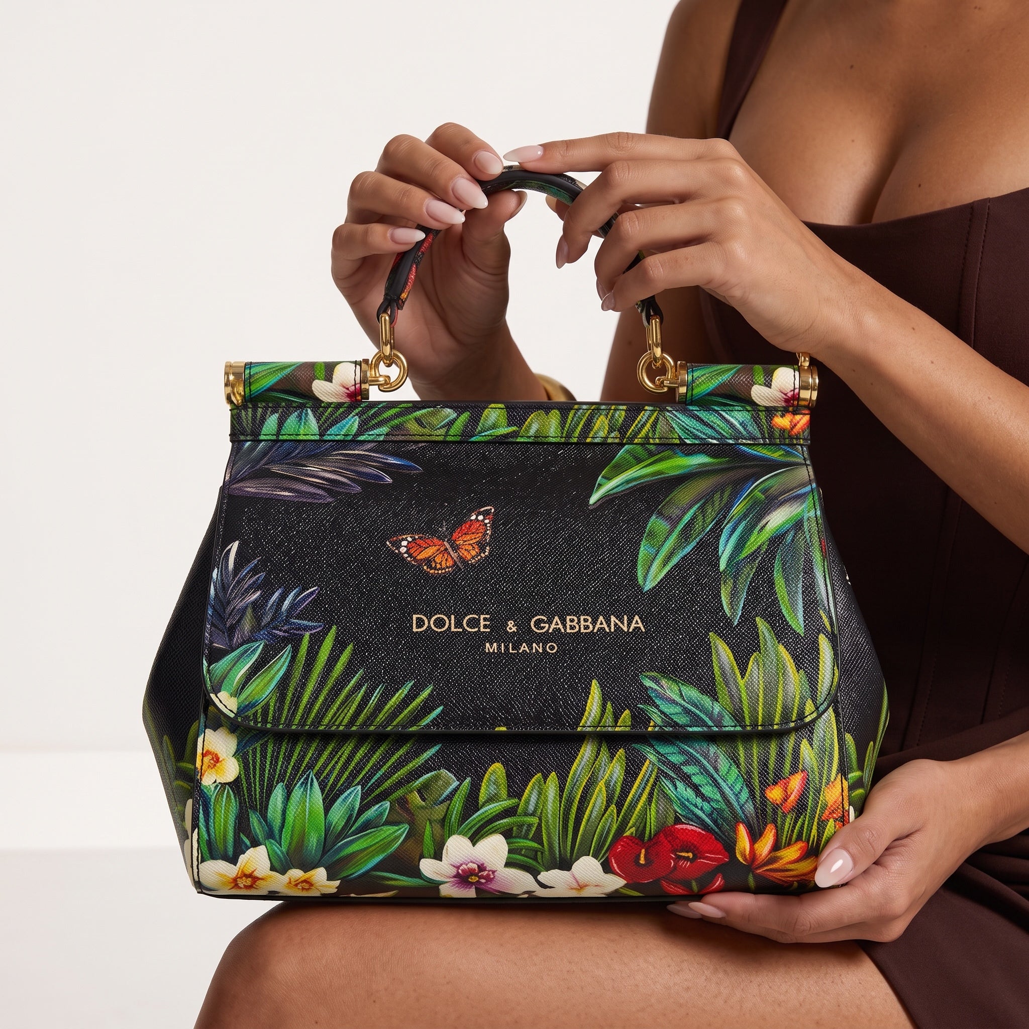 Dolce & Gabbana black Sicily top-handle bag with colourful tropical floral and butterfly print and gold hardware