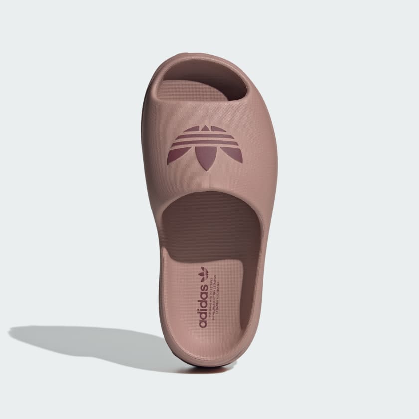blush pink Adidas platform slide with embossed trefoil logo
