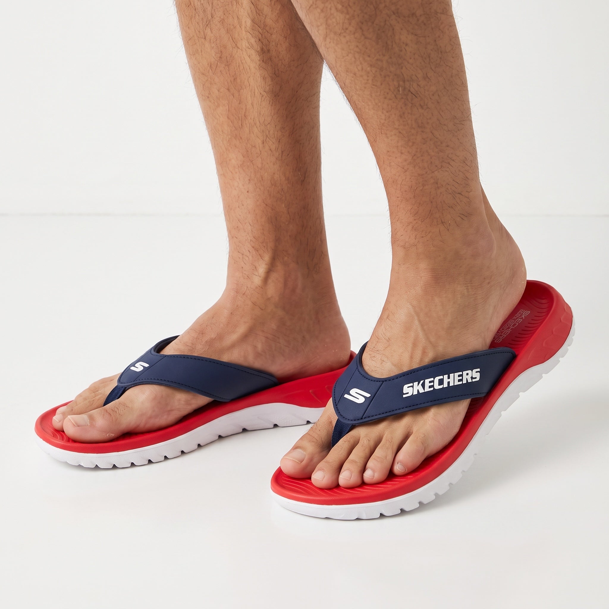 Skechers navy and red men's thong slides with white sole
