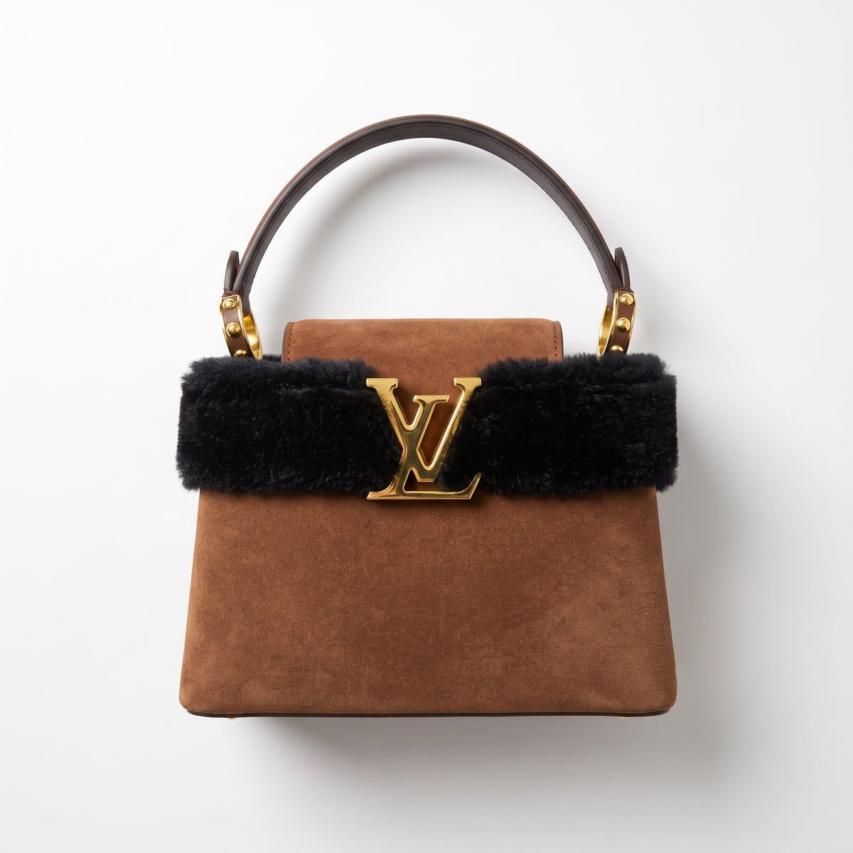 Brown suede top-handle bag with black fur trim and gold LV logo
