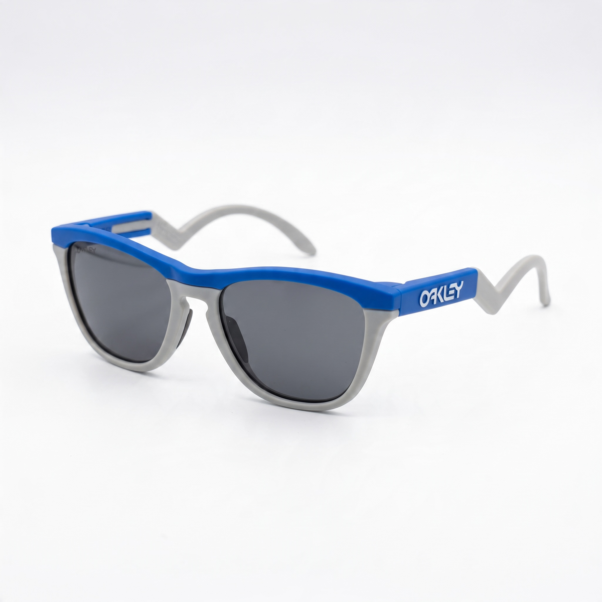 Oakley two-tone blue and grey wrap sunglasses with dark lenses