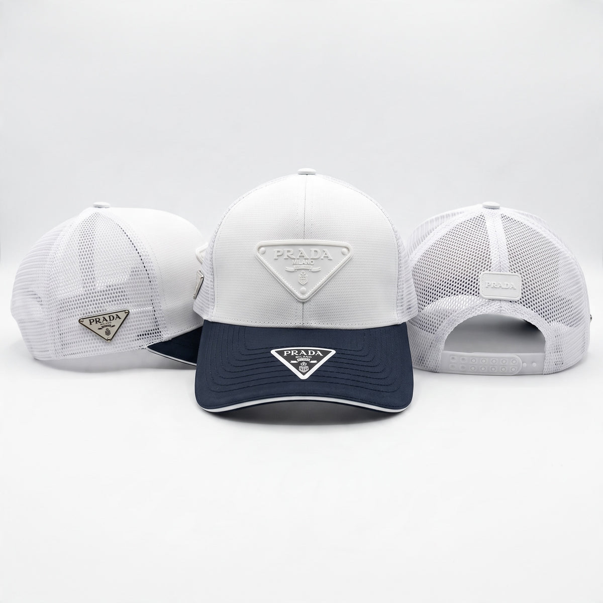 Prada white trucker cap with navy visor and mesh back showing triangle logo