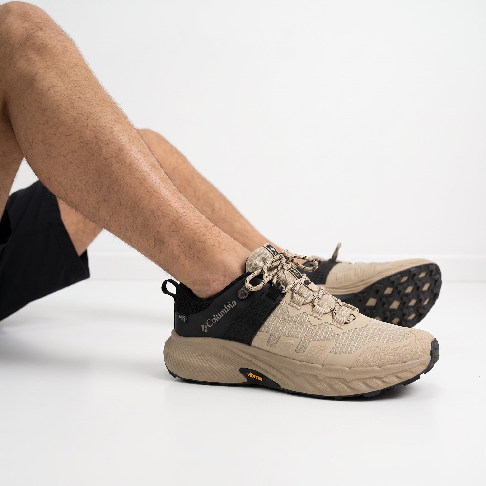 Columbia low-top sand and black trail sneaker with Vibram sole